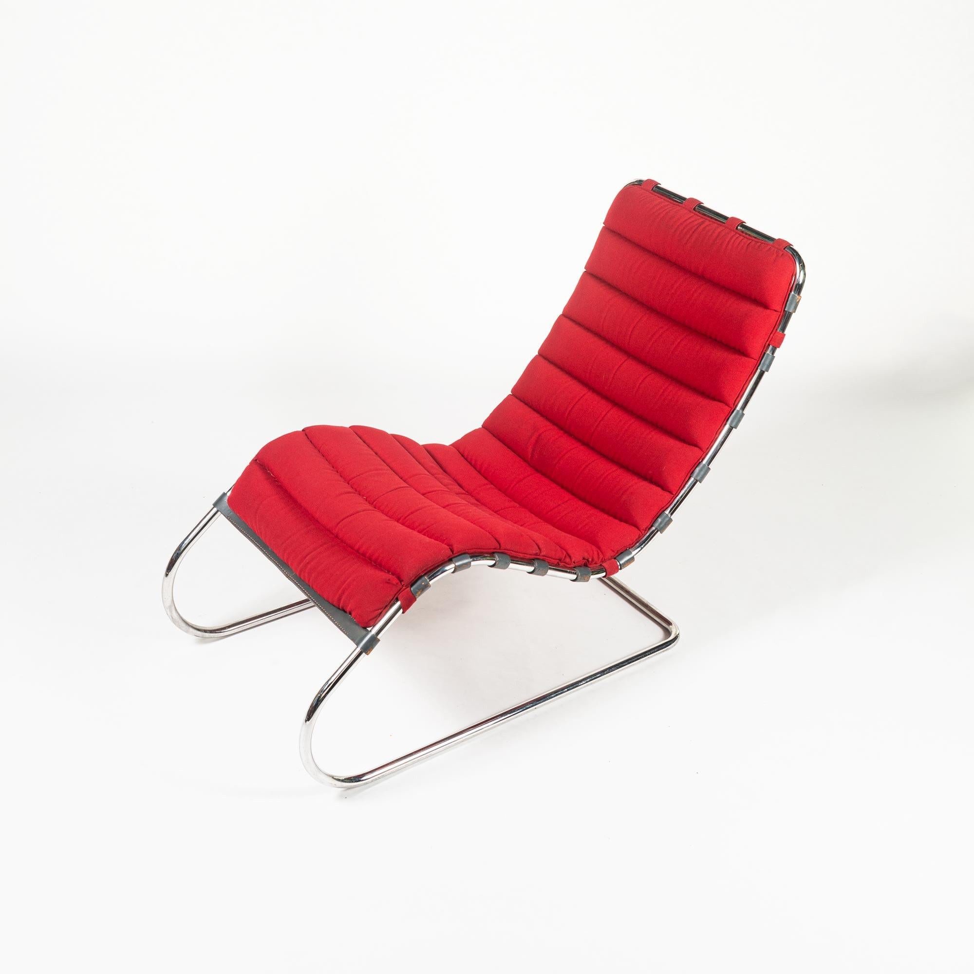 Mies van der Rohe’s MR chaise lounge was designed in 1927. This MR chaise lounge Chair is in original red upholstery fabric cushion with a cantilevered tubular chromed steel frame and leather straps, circa 1985. The listing is for MR chaise lounge