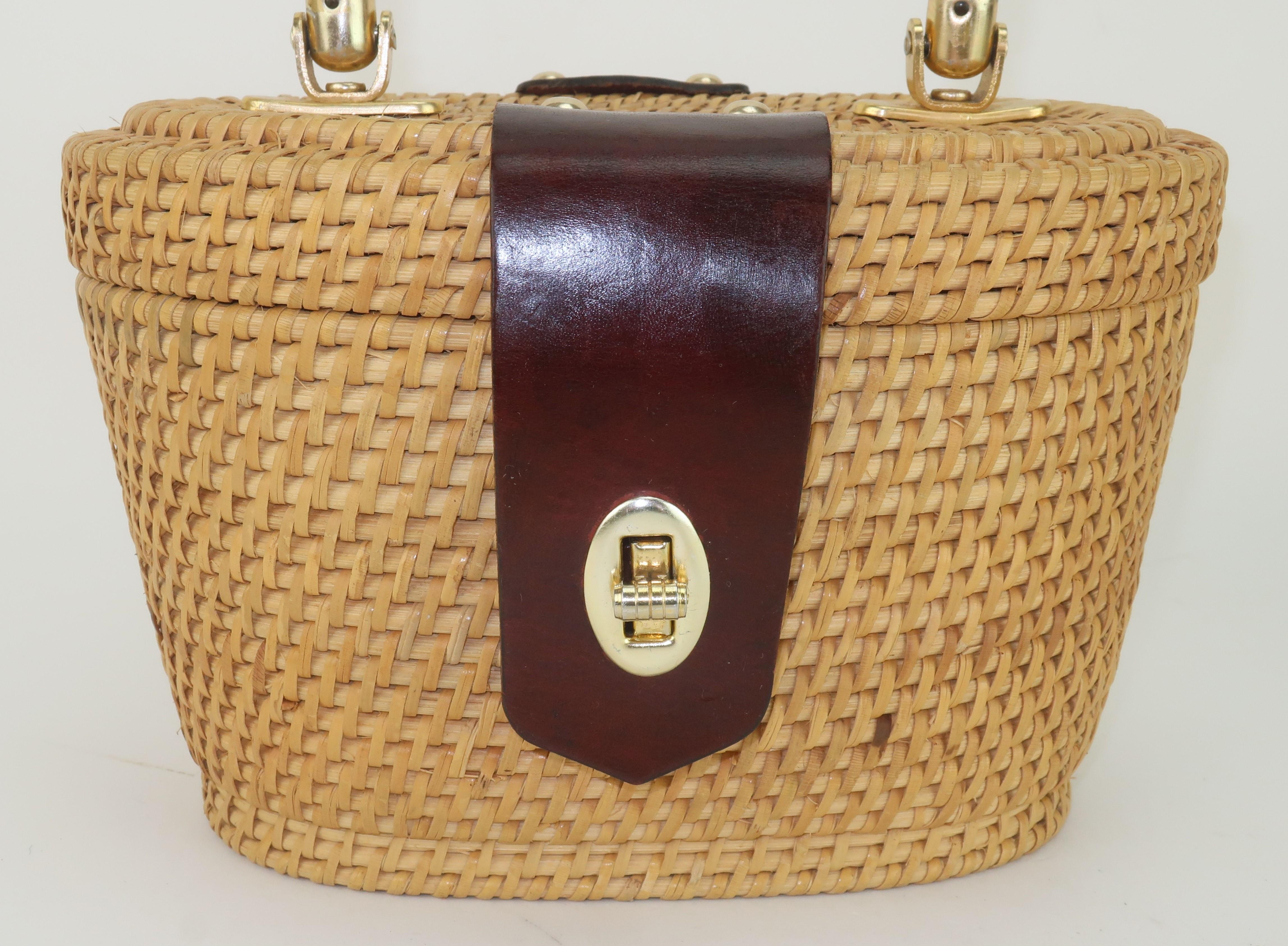 A-tisket a-tasket … a Mr. Ernest basket!  Just in time to add a little frivolity to your Spring and Summer wardrobe … a 1960’s wicker handbag with leather details, including a leather covered top handle, by Ernest Blum for Simon.  The bag has a turn