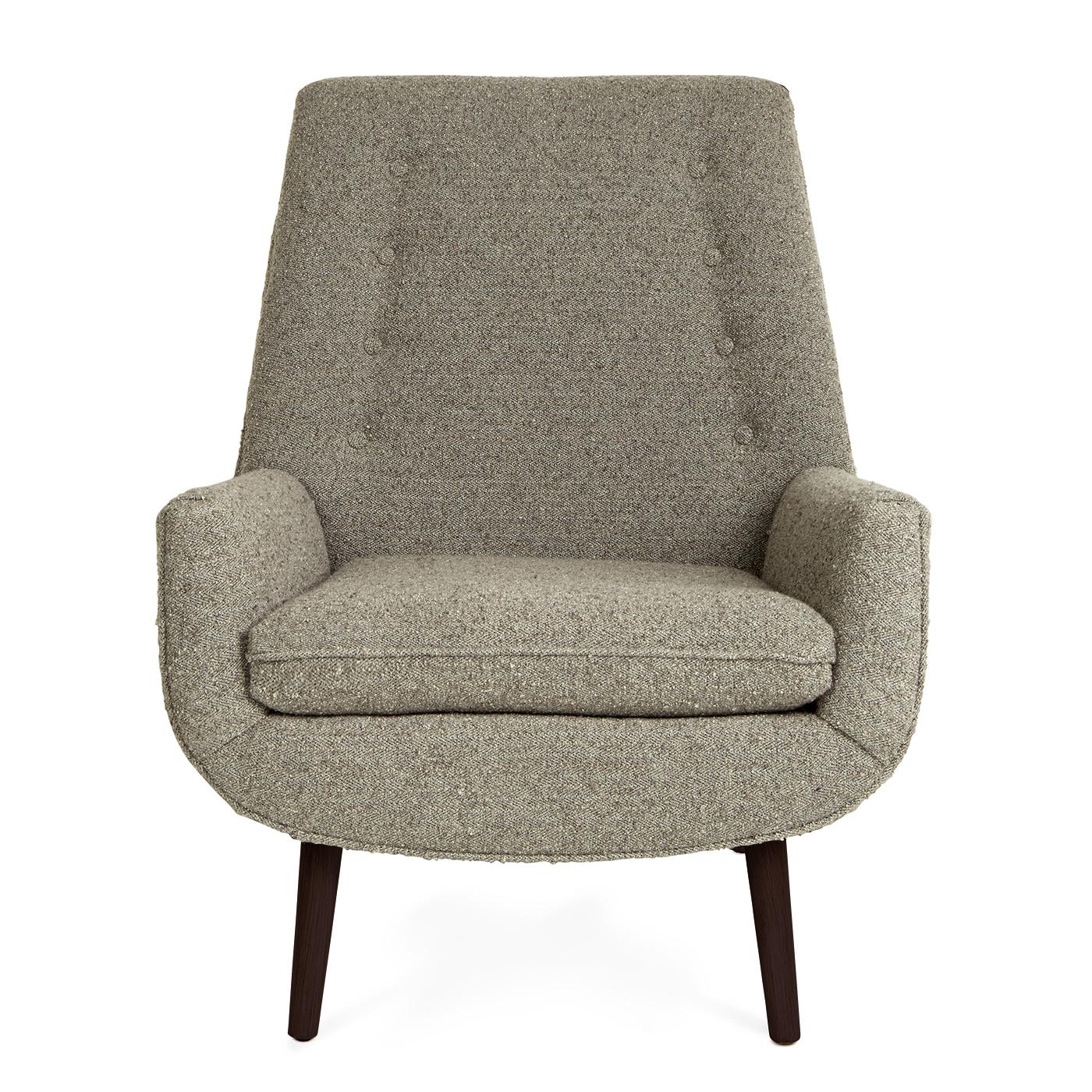Perfect Pitch. A scaled-up version of our Mrs. Godfrey chair, our Mr. Godfrey chair speaks with a more commanding voice. It boasts a deeper pitch and thicker cushions for a clubbier persona. This dapper style is finished with piped edges and buttons