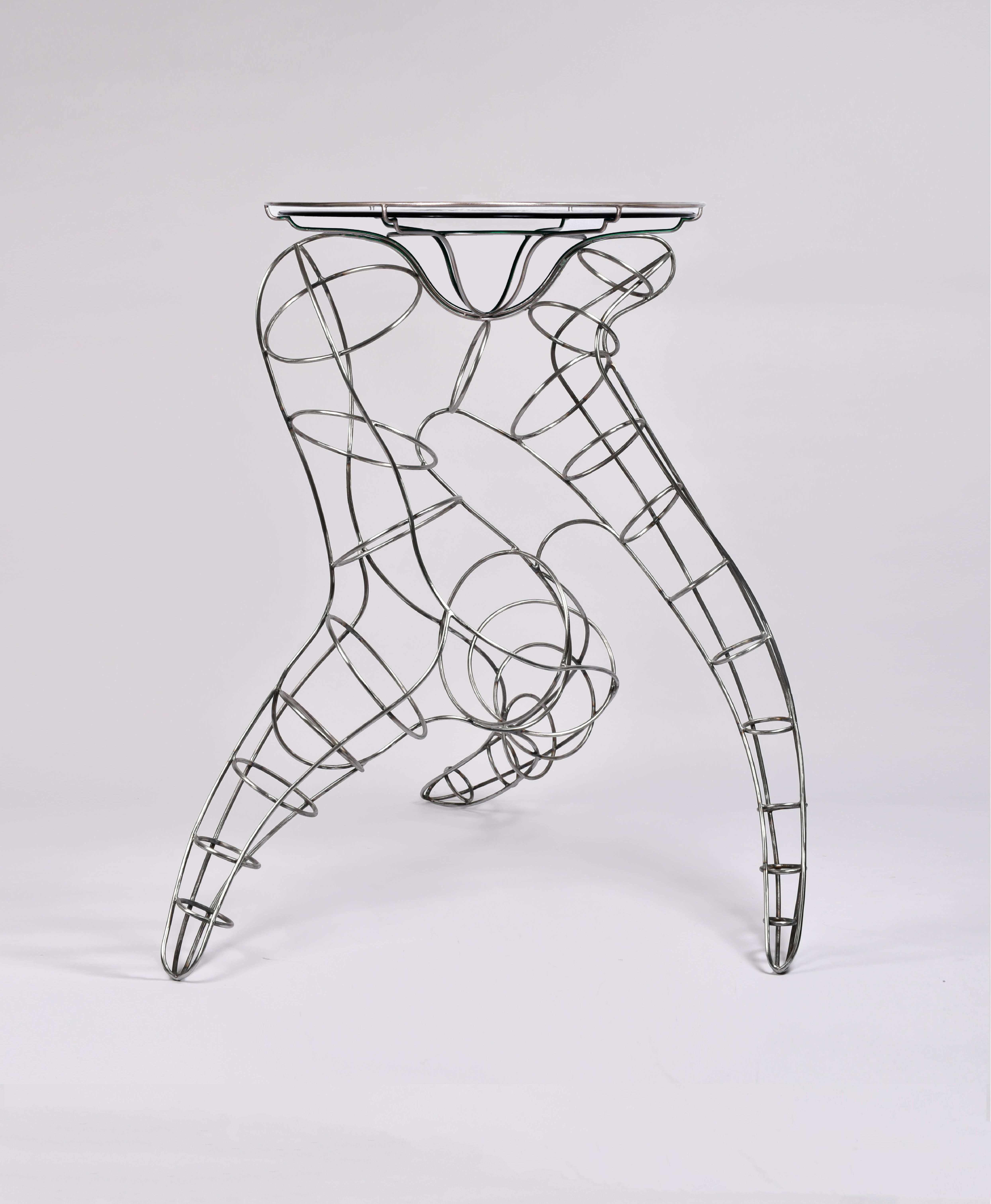 Mr. Joe Ruby Red Console Table by Alice Crepaldi
Unique Piece.
Dimensions: Ø 90 x H 100 cm.
Materials: Glass and metal.

Alice Crepaldi is a versatile multidisciplinary artist hailing from Milan, Italy. Her artistic endeavors are deeply entrenched