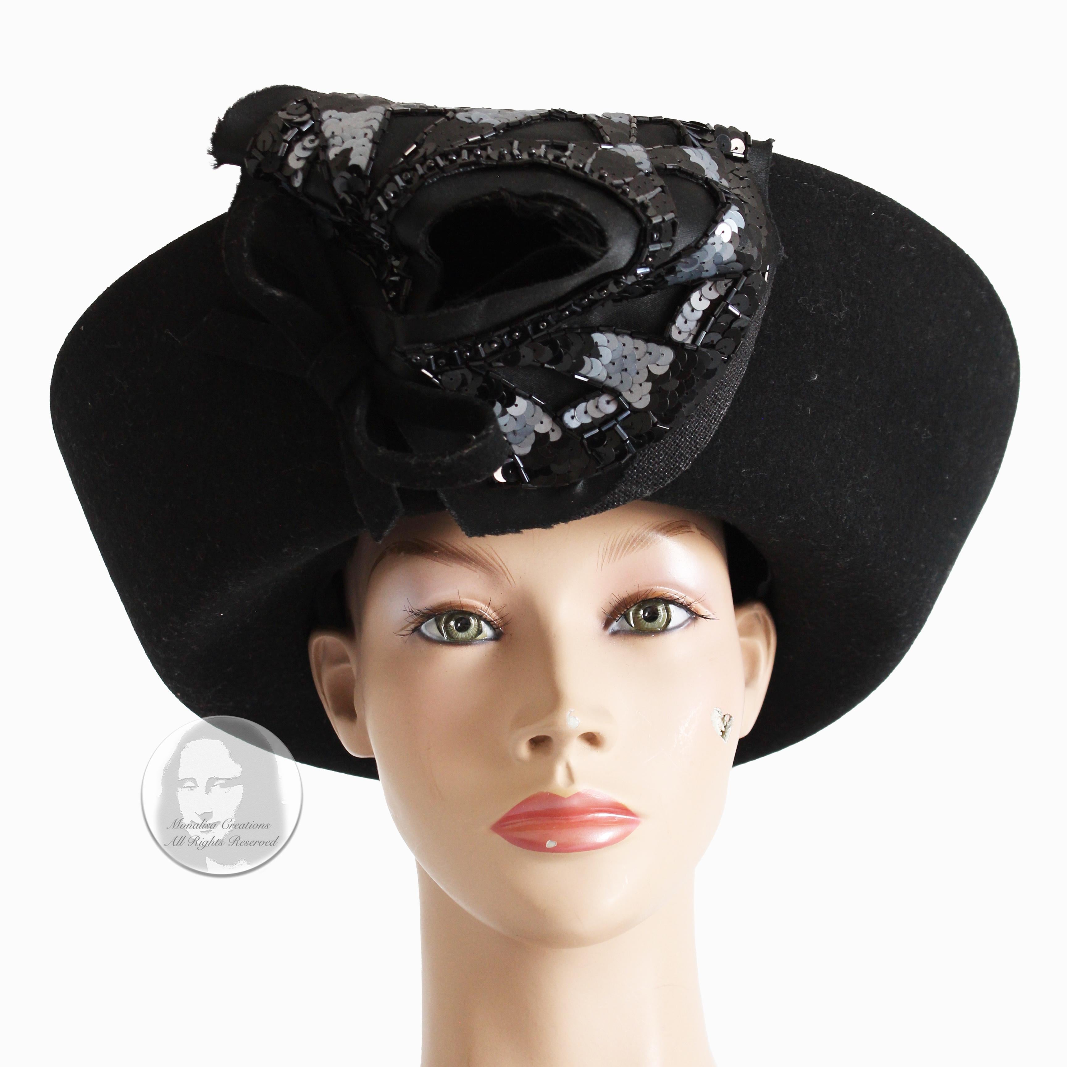 Preowned, vintage Breton style hat, made by milliner Mr. John, most likely in the 60s.  Made from black felt wool, it features a wide upturned brim and an embellished bow at the front.

A fabulous, high fashion hat that's perfect for your events and