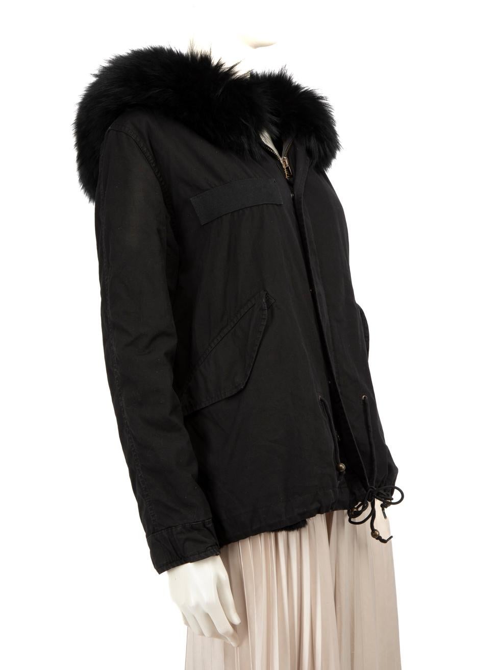 CONDITION is Very good. Minimal wear to the coat is evident, there is light discolouration around the cuffs and the edges of the front pockets. The head of the zipper is tarnished and there is some friction wear around the right under arm which has