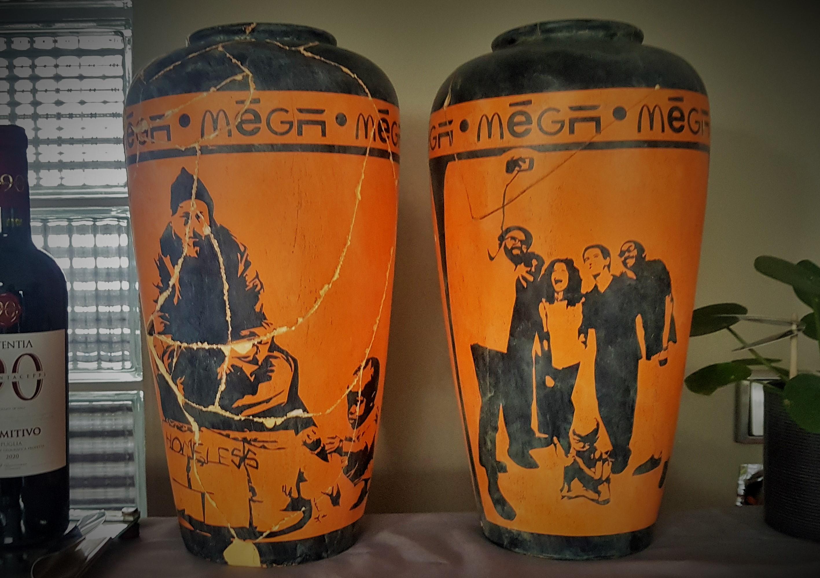 MR TAD contemporary artist from saarbrücken germany. *1968

pair of vases style ancient greek.
from the series 'europe meets africa'
acrylic paint on ceramic vessel.

urban art / street art.