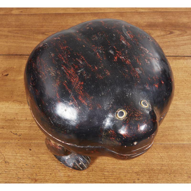 Hand-carved wood lacquered box in the shape of a stylized toad with eyes and legs and lift-off top. Heavy and substantial. Japanese, early 20th c.