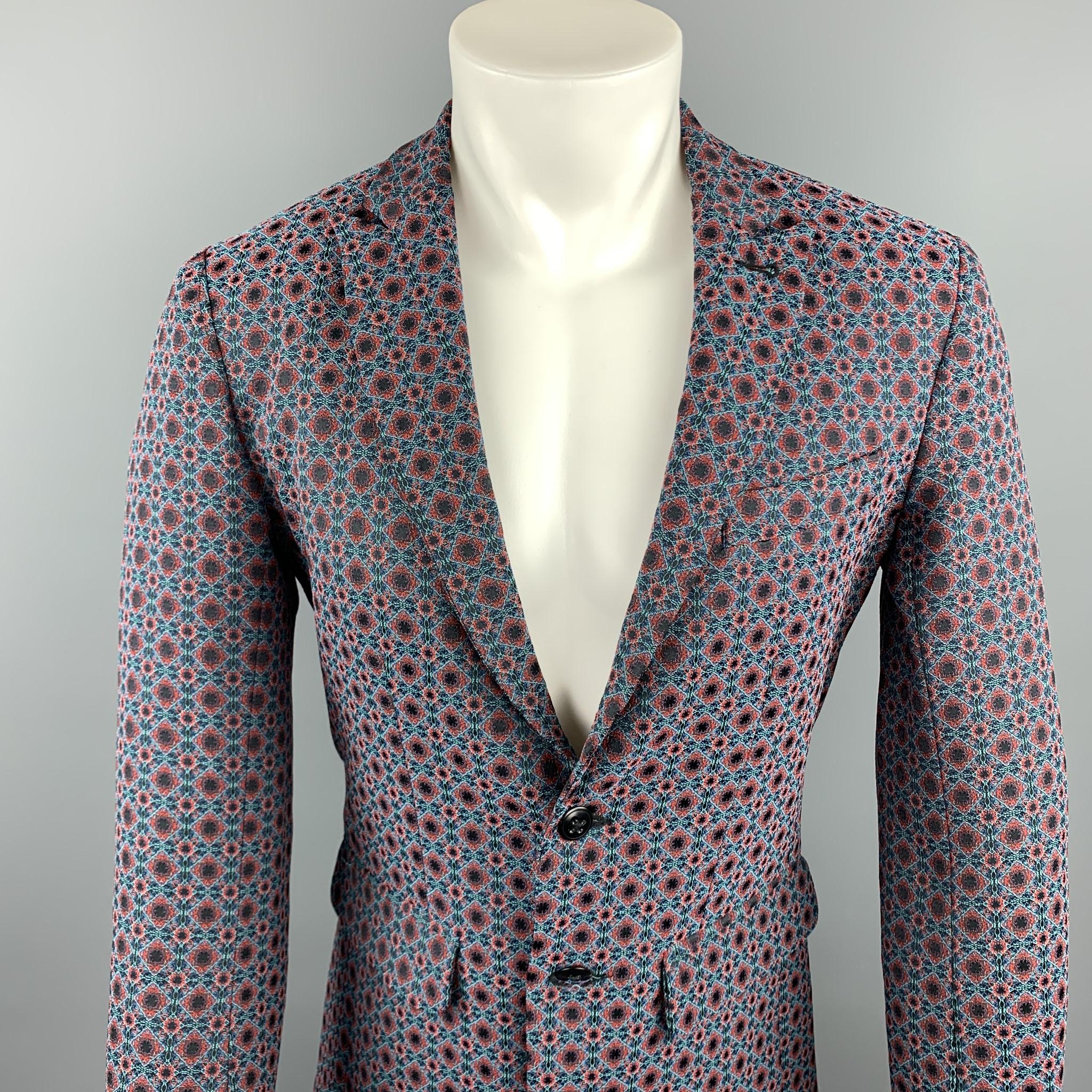 MR.TURK sport coat comes in a blue & red print polyester blend featuring a peak lapel style, flap pockets, and a two button closure. Made in USA.

New With Tags.
Marked: 36

Measurements:

Shoulder: 16.5 in.
Chest: 36 in. 
Sleeve: 25.5 in. 
Length: