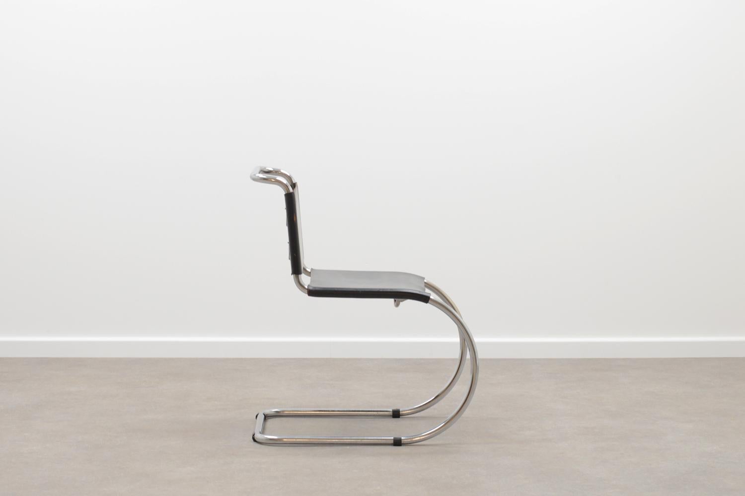 MR10 cantilever chair by Ludwig Mies van der Rohe. Chrome tubular frame, black saddle leather seating and leather rope. Unknown manufacturer, circa 1960. Leather rope is new and rest in good vintage condition. 

 