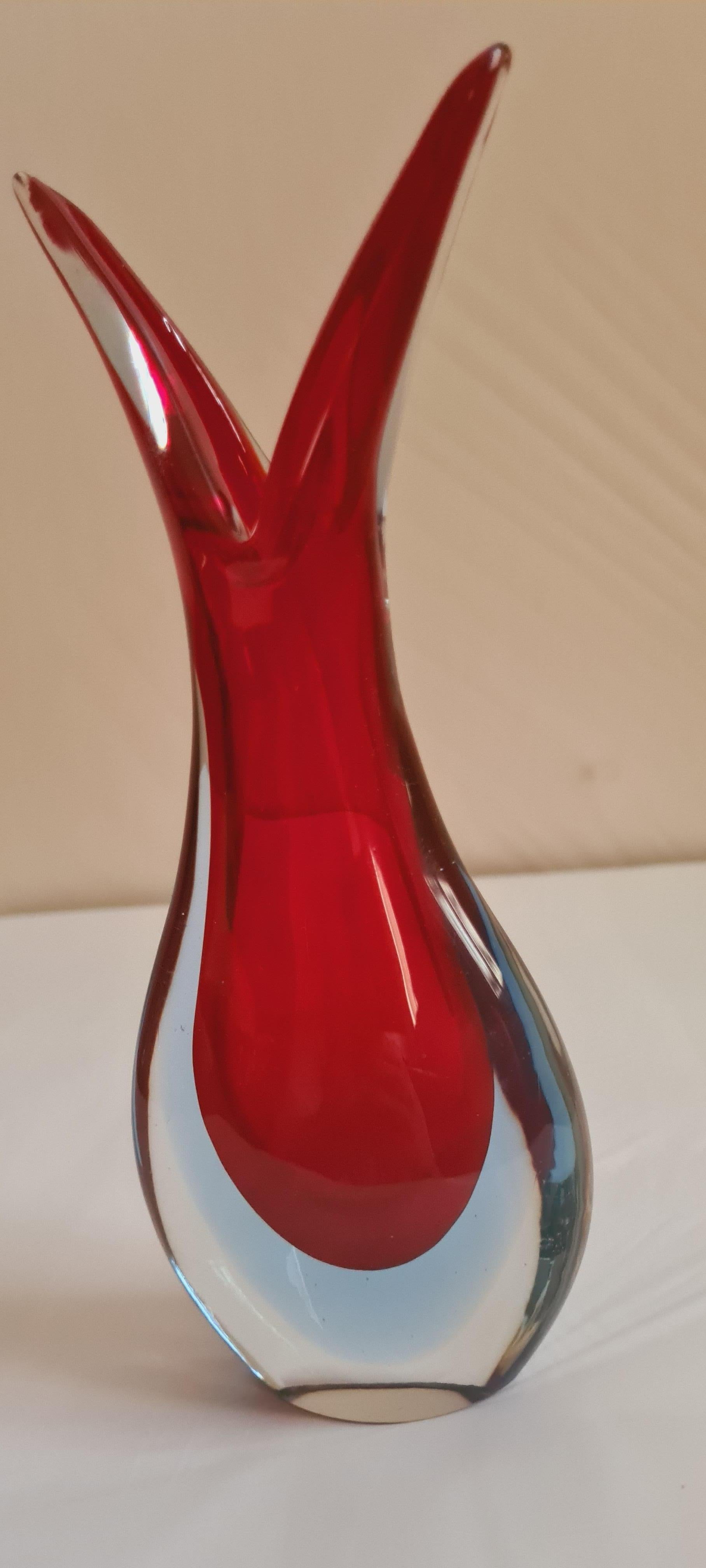 Beautiful Murano glass sommerso vase and carafe in red, blue and clear, attributed to Flavio Poli; years 1950-1960. The carafe is 30cm and the vase is 20cm tall. In excellent condition.