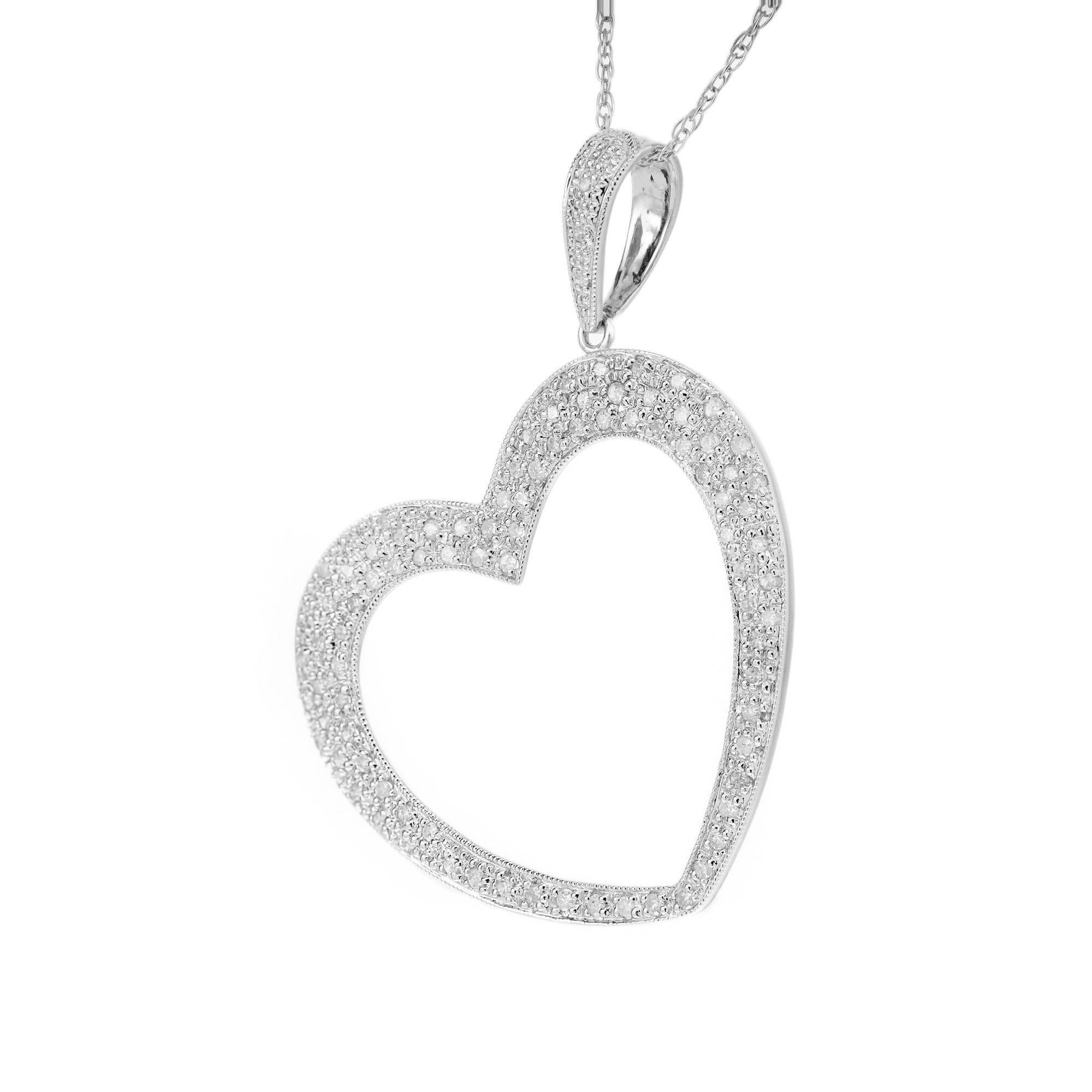 Large diamond heart pendant necklace. 100 round diamonds pave set in a heart shape 14k white gold setting. 17.5 long link chain.  The bail is set off to the side. 

100 round diamonds approx. total weight .65cts, G, SI.  
14k white gold 
Stamped: