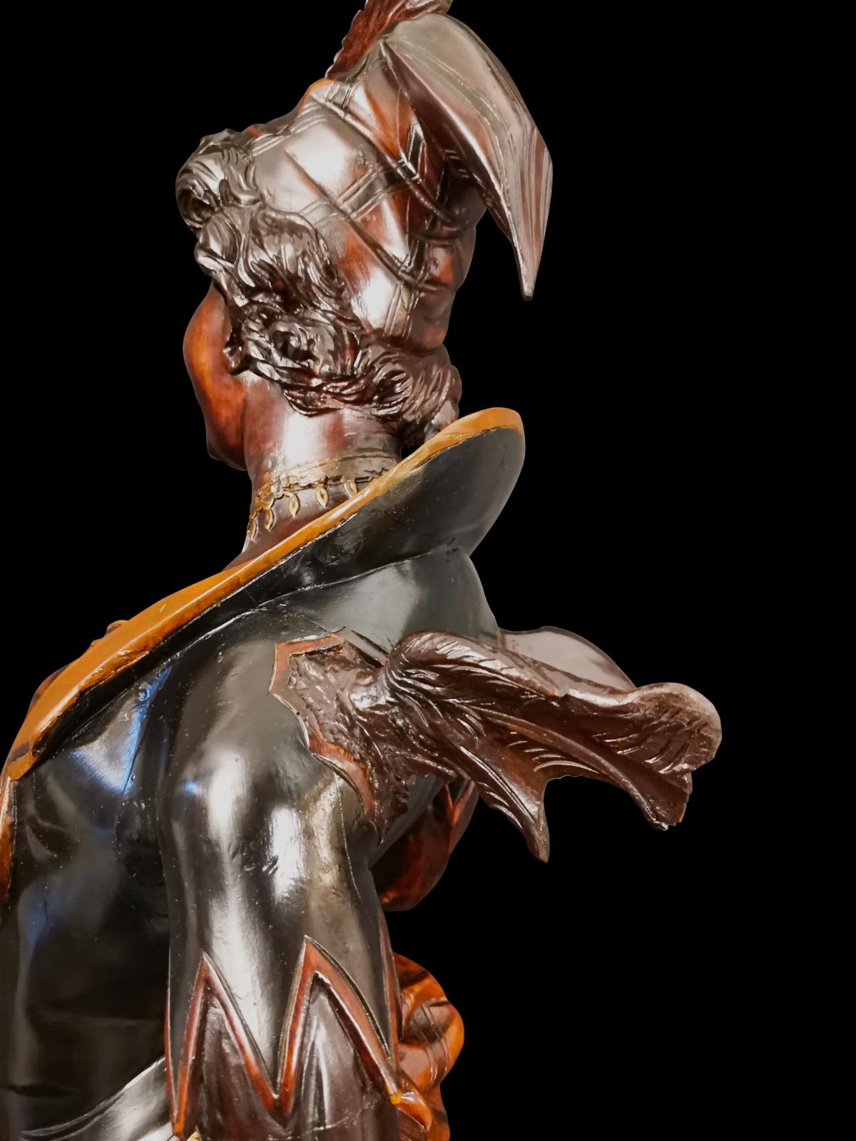 This is a mephistophelic figure in solid wood carved of 