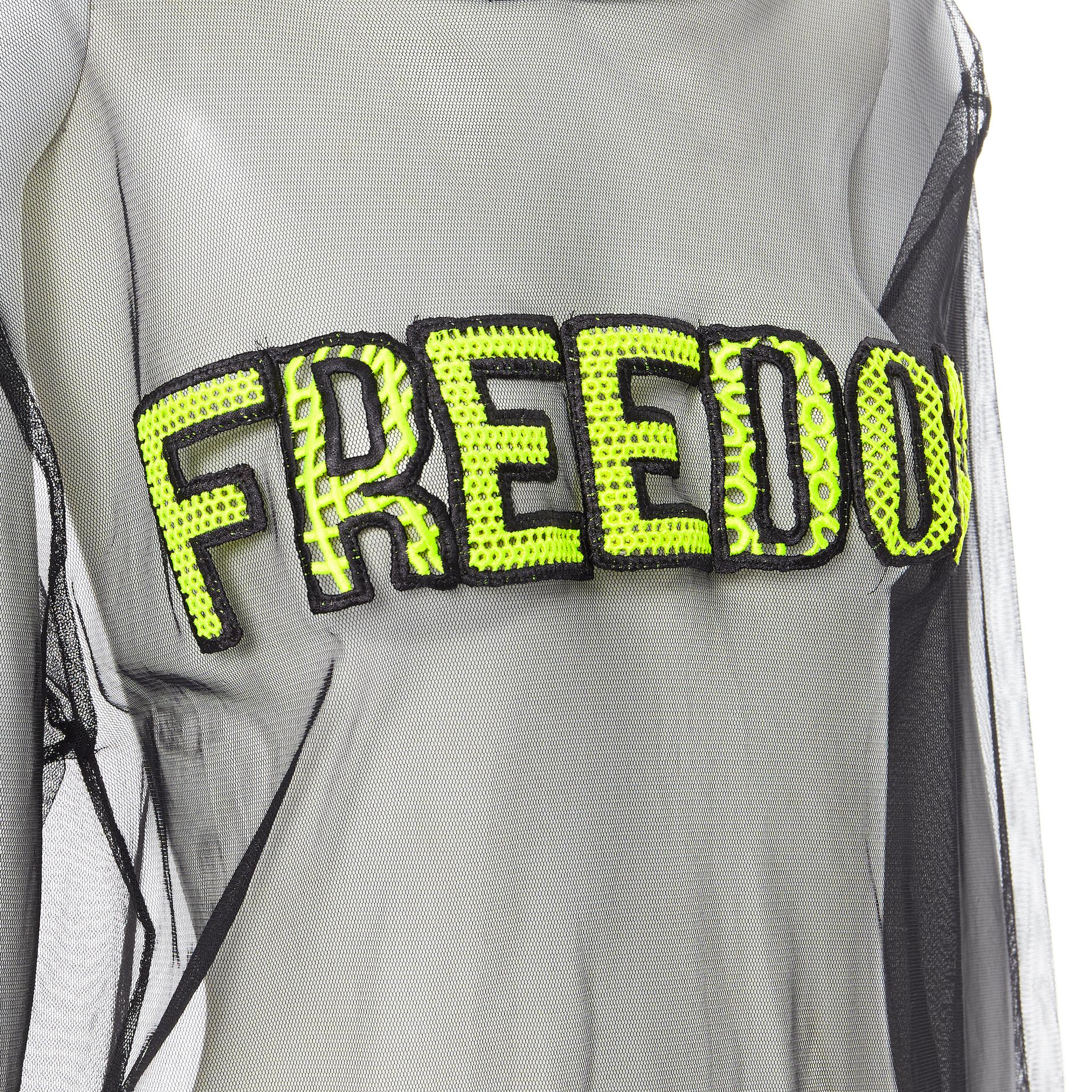 MSGM Freedom neon yellow patch black sheer hooded pullover top Fr38 S 
Reference: WEYN/A00369 
Brand: MSGM 
Material: Polyamide 
Color: Black 
Pattern: Solid 
Extra Detail: Pullover. Hooded. Freedom patch at front. 
Made in: Italy 

CONDITION: