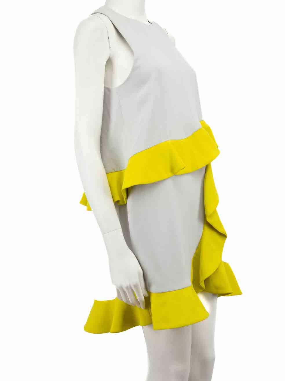 CONDITION is Very good. Hardly any visible wear to dress is evident on this used MSGM designer resale item.
 
 Details
 Grey
 Polyester
 Mini dress
 Round neckline
 Yellow contrast ruffles accent
 Sleeveless
 Back zip closure with hook and eye
 
 

