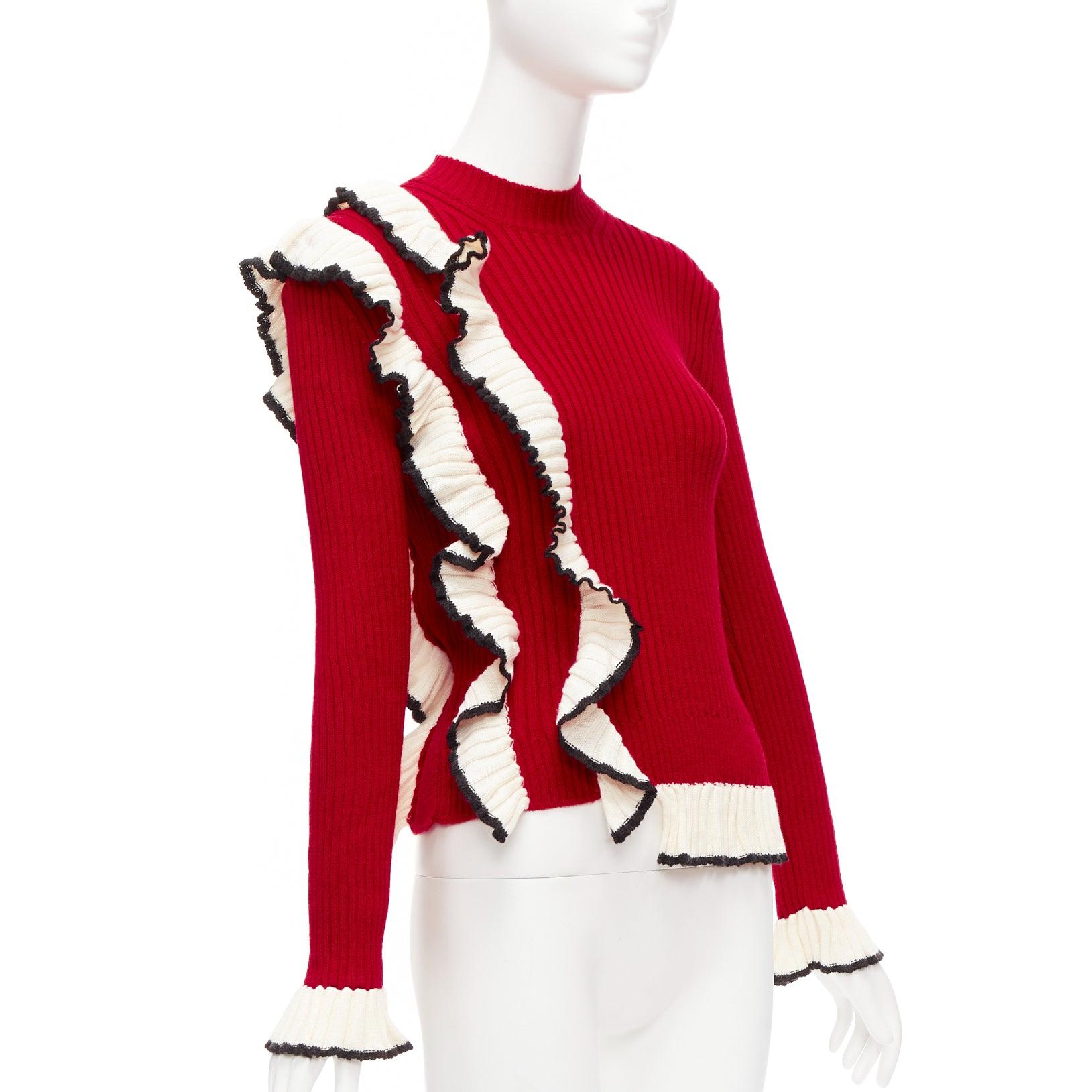 MSGM red wool blend white ruffle trim flared cuff ribbed knit sweater top XS
Reference: AAWC/A00642
Brand: MSGM
Material: Wool, Acrylic
Color: Red, Cream
Pattern: Solid
Extra Details: Ruffle trim designed to like it is connected to hem.
Made in: