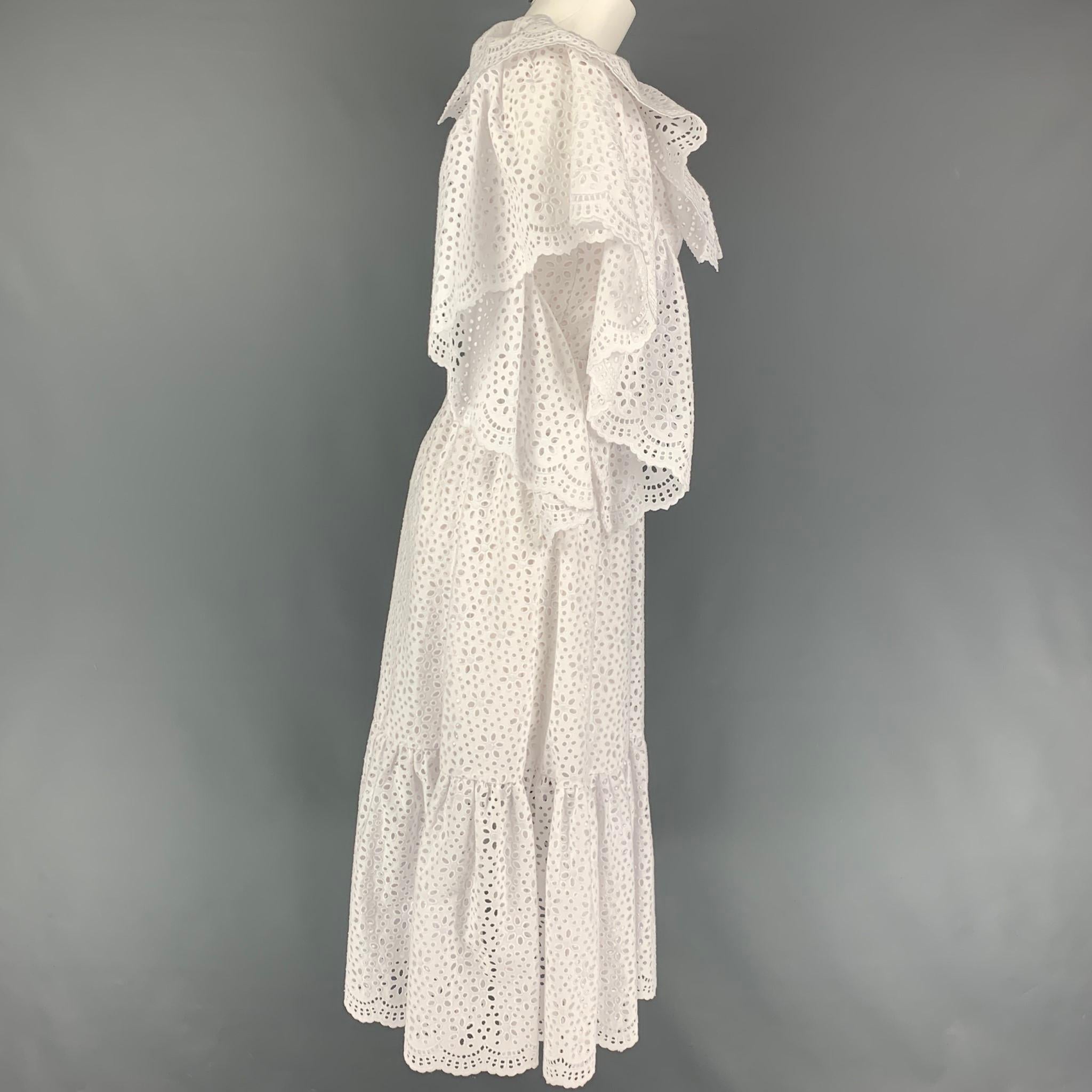MSGM dress comes in a white eyelet cotton featuring an a-lie style, ruffled details, sleeveless, slit pockets, ad a back zip up closure. 

New With Tags.
Marked: 38
Original Retail Price: $1,300.00

Measurements:

Shoulder: 11 in.
Bust: 32