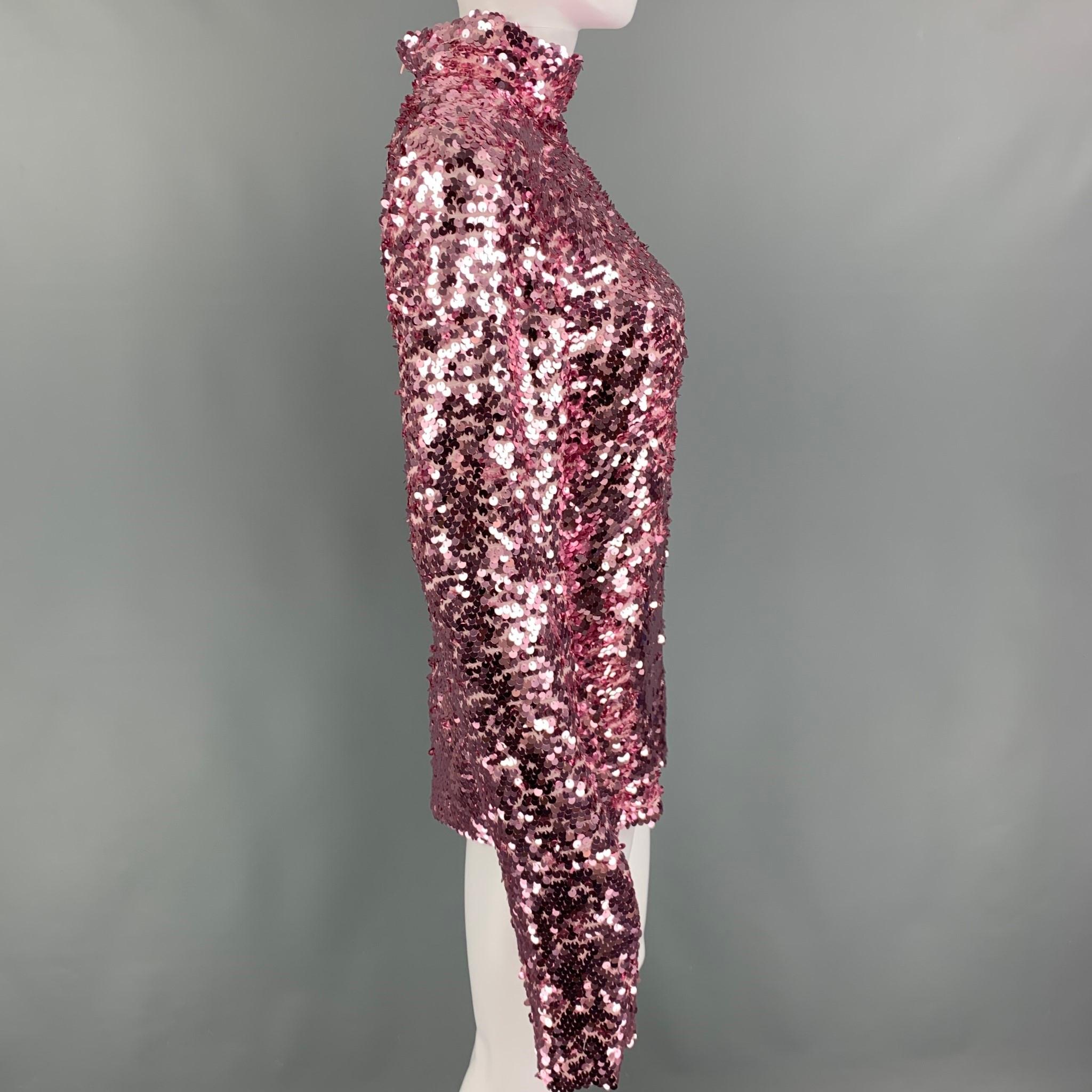 MSGM dress top comes in a pink sequined viscose featuring a high collar, long sleeve, and a back zip up closure. 

Excellent Pre-Owned Condition.
Marked: 42

Measurements:

Shoulder: 16 in.
Bust: 36 in.
Sleeve: 28 in.
Length: 24 in.