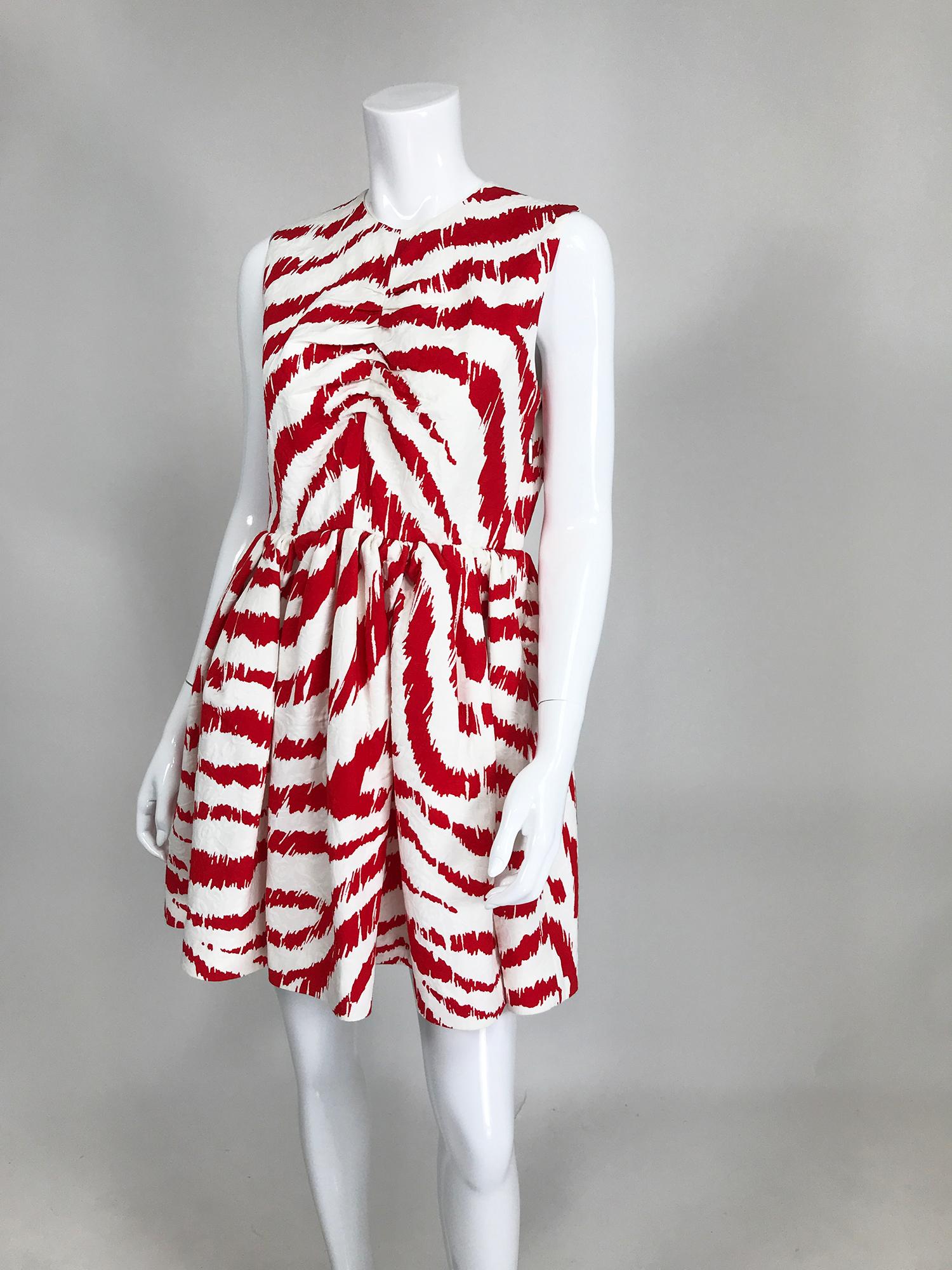 MSGN Milano red & white zebra print cotton blend dress unworn with tags. Jewel neckline, sleeveless dress with a center shirred seam front, the full skirt sits just below the natural waist and has on seam side pockets. The dress closes at the back