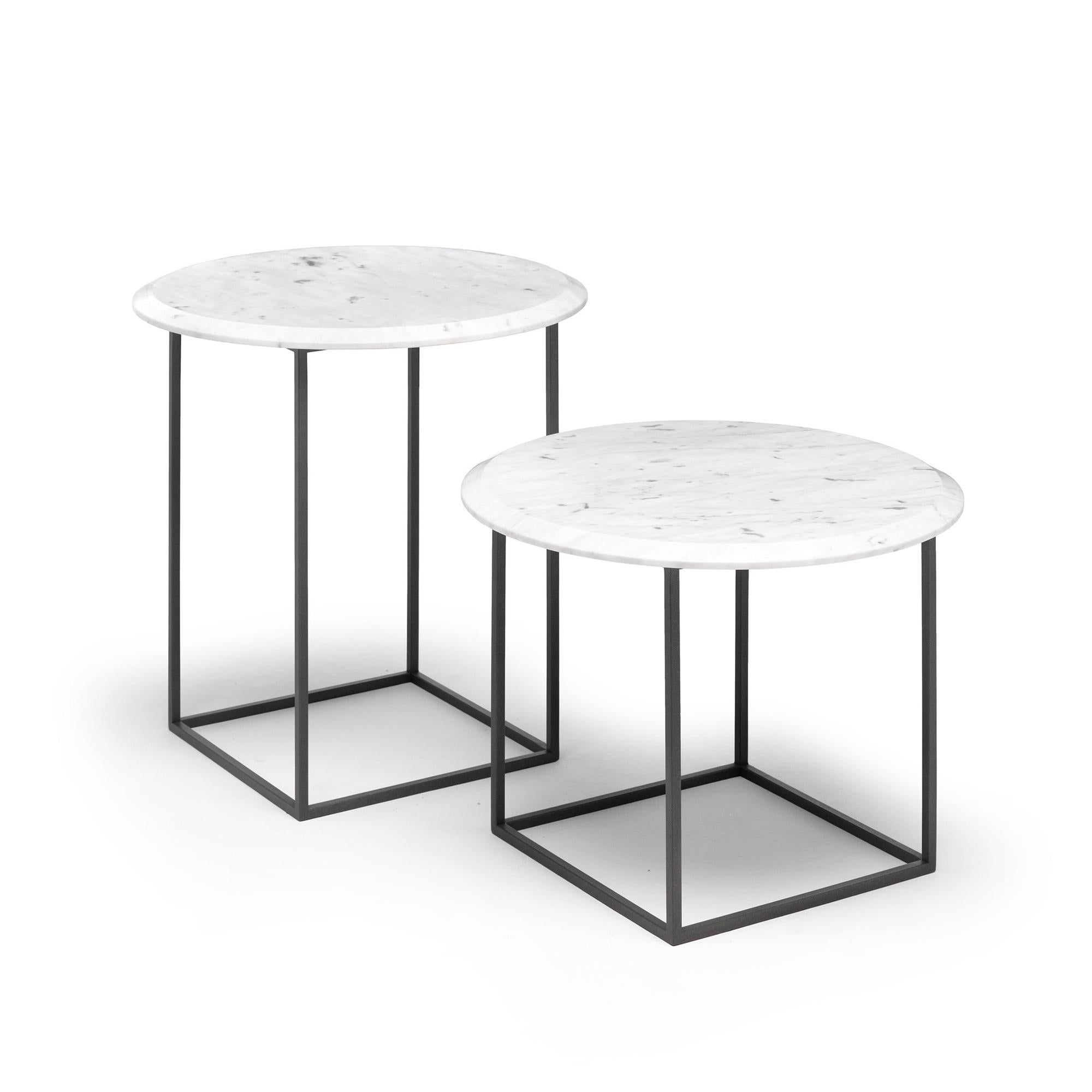 The MT sidetable/nightstand is simple and rich at the same time. The base is made with a very thin squared metal tubing which results in physically and visually light and clean geometric structure. The circular top is thick solid marble made