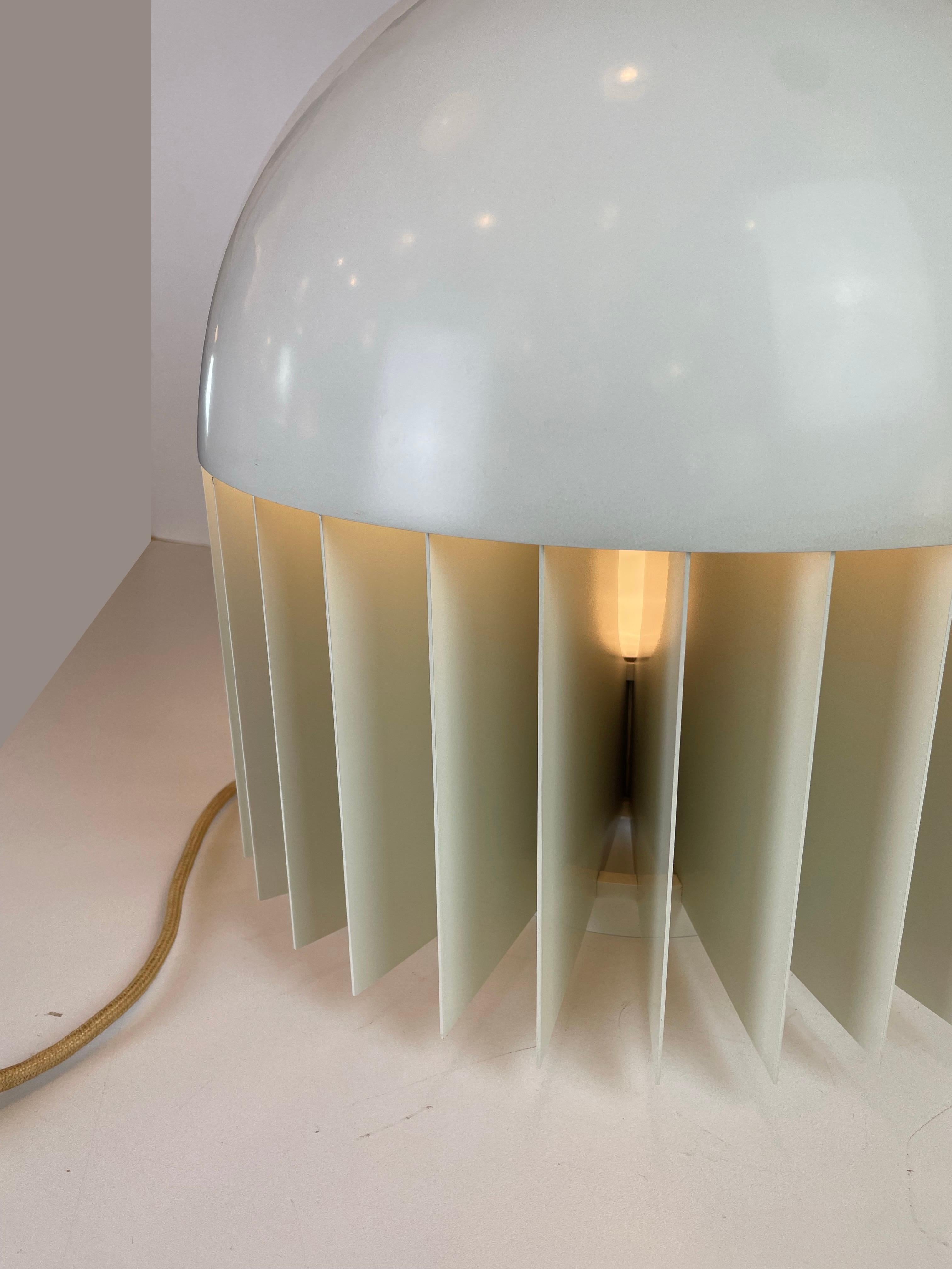 Rare and exceptional table lamp named MT, this complete piece is made of off-white enameled steel, which a glass lamp shade and a chromed handle under the steel dome, and still have its original cord and switch. Designed by Giancarlo Mattioli (Nesso