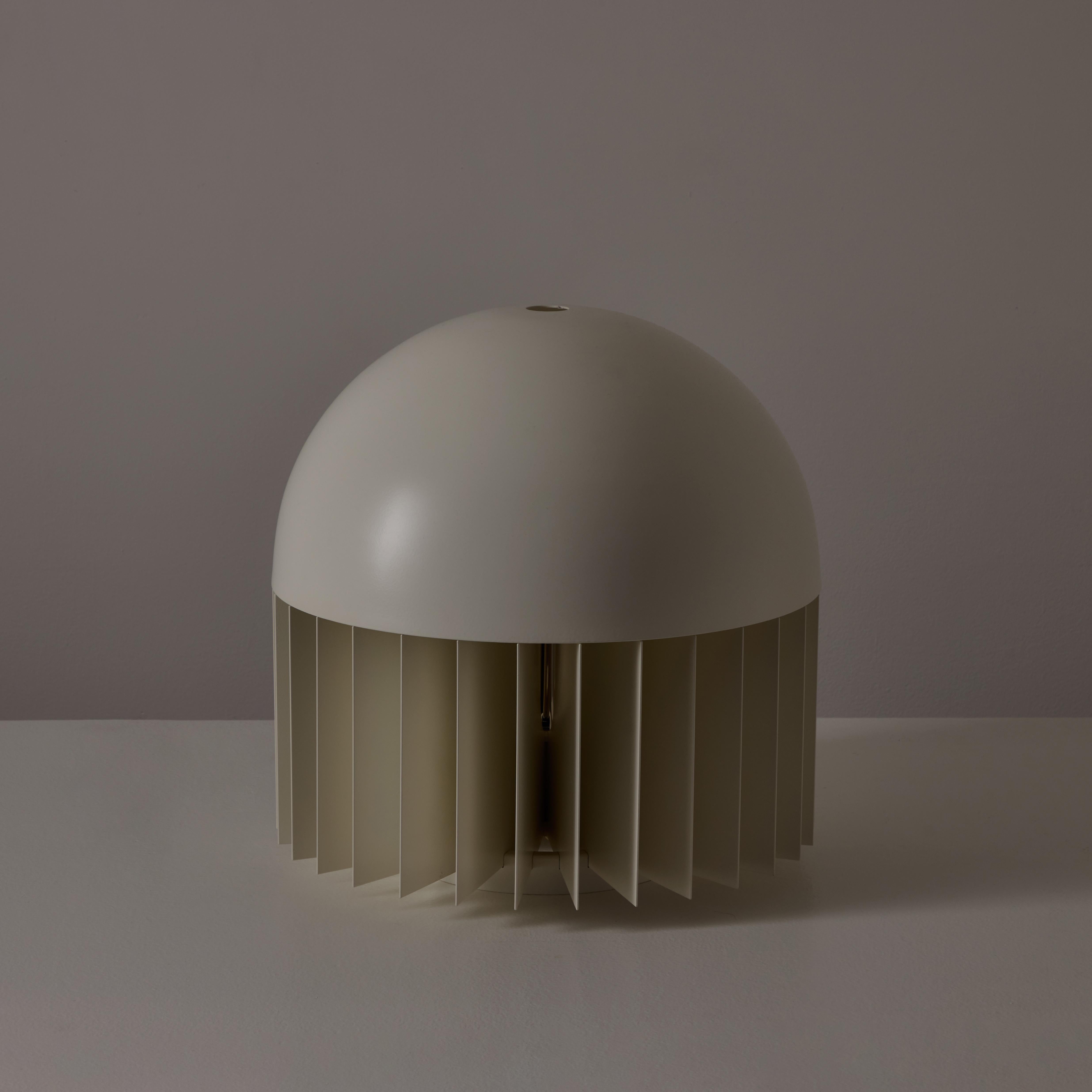 'MT' Table Lamp by Giancarlo Mattioli for Sirrah. Designed and manufactured in Italy, 1969. Architectural monolithic table lamp comprising of a paneled bottom base and a domed top cover. The bottom is layered by enameled steel panels, installed