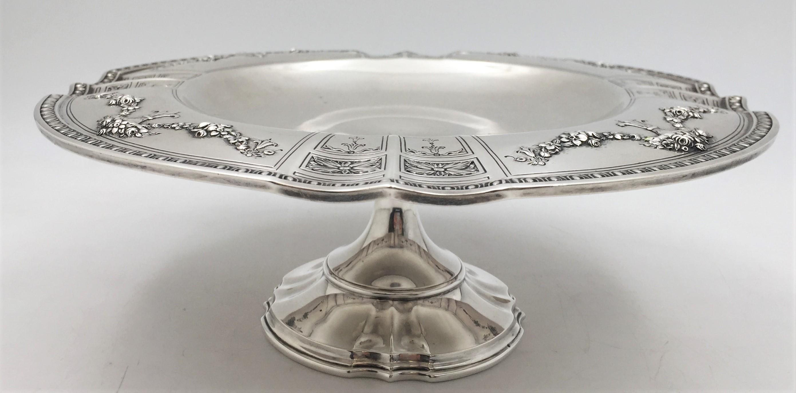 Mount Vernon, sterling silver compote centerpiece, made between 1913 and 1923, with an ornate, gadrooned rim depicting garlands of flowers and decorative motifs in cartouches. It measures 10 1/2'' in diameter by 4'' in height, weighs 22.5 troy
