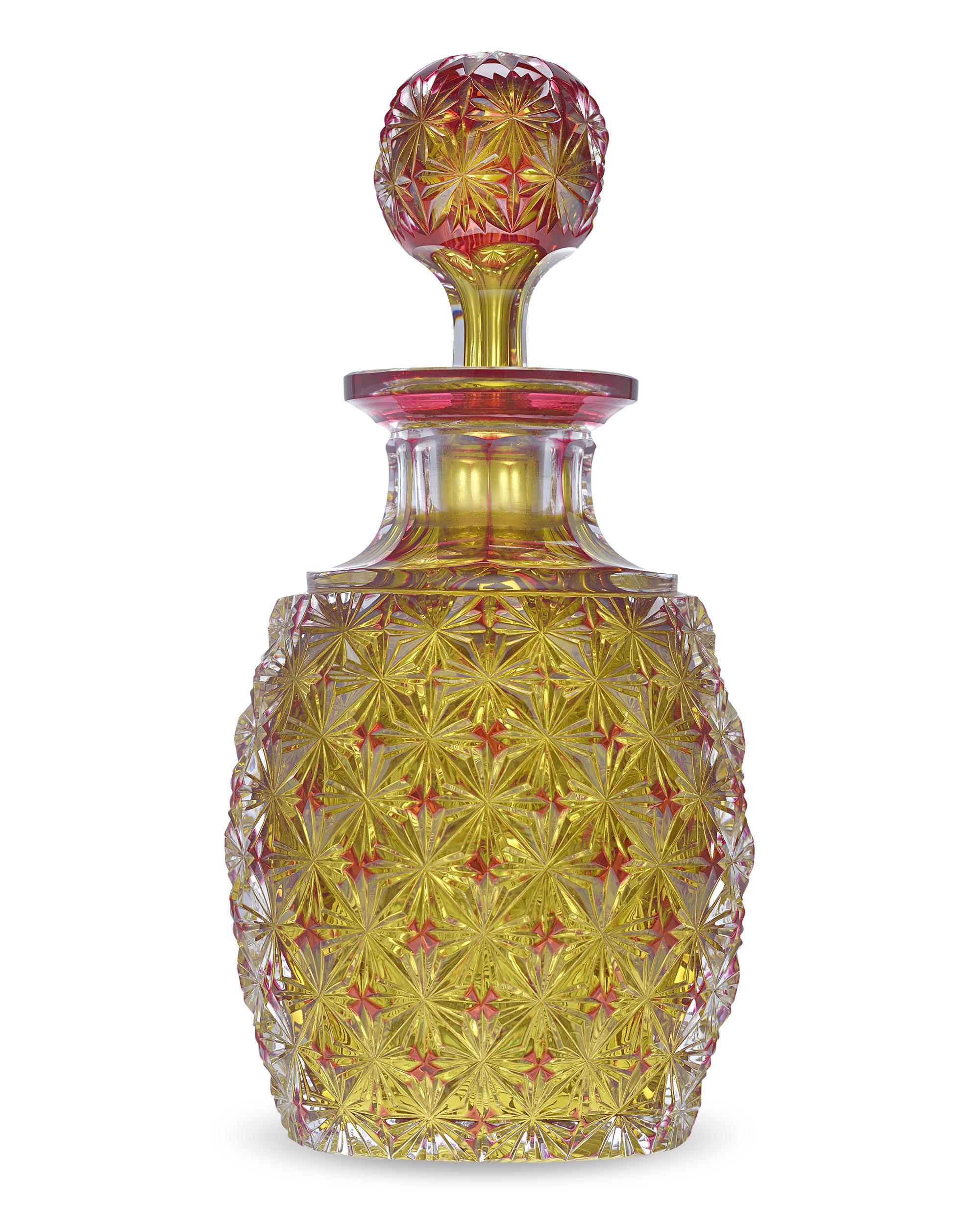 This incredibly rare and extraordinarily beautiful cologne bottle from Mt. Washington Glass Works features a dense yellow foliate motif overlaid above rich red glass. The overall effect is lush and opulent, reflecting the finest work of the company.