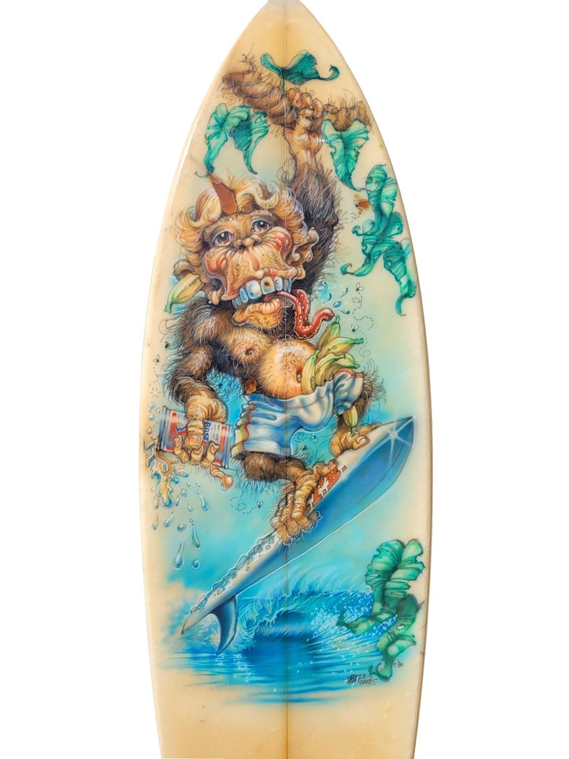 Vintage 1980 MTB ‘Surfing Monkey’ surfboard with mural artwork by the renowned Phil Roberts. Features airbrushed work of art depicting a monkey surfing with a Budweiser beer. Airbrushed in Robert’s signature art style and signed “Phil Roberts 7/80”.