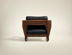 MŪ61 Solid Walnut Lounge Chair with Leather Upholstery by MŪVEK
