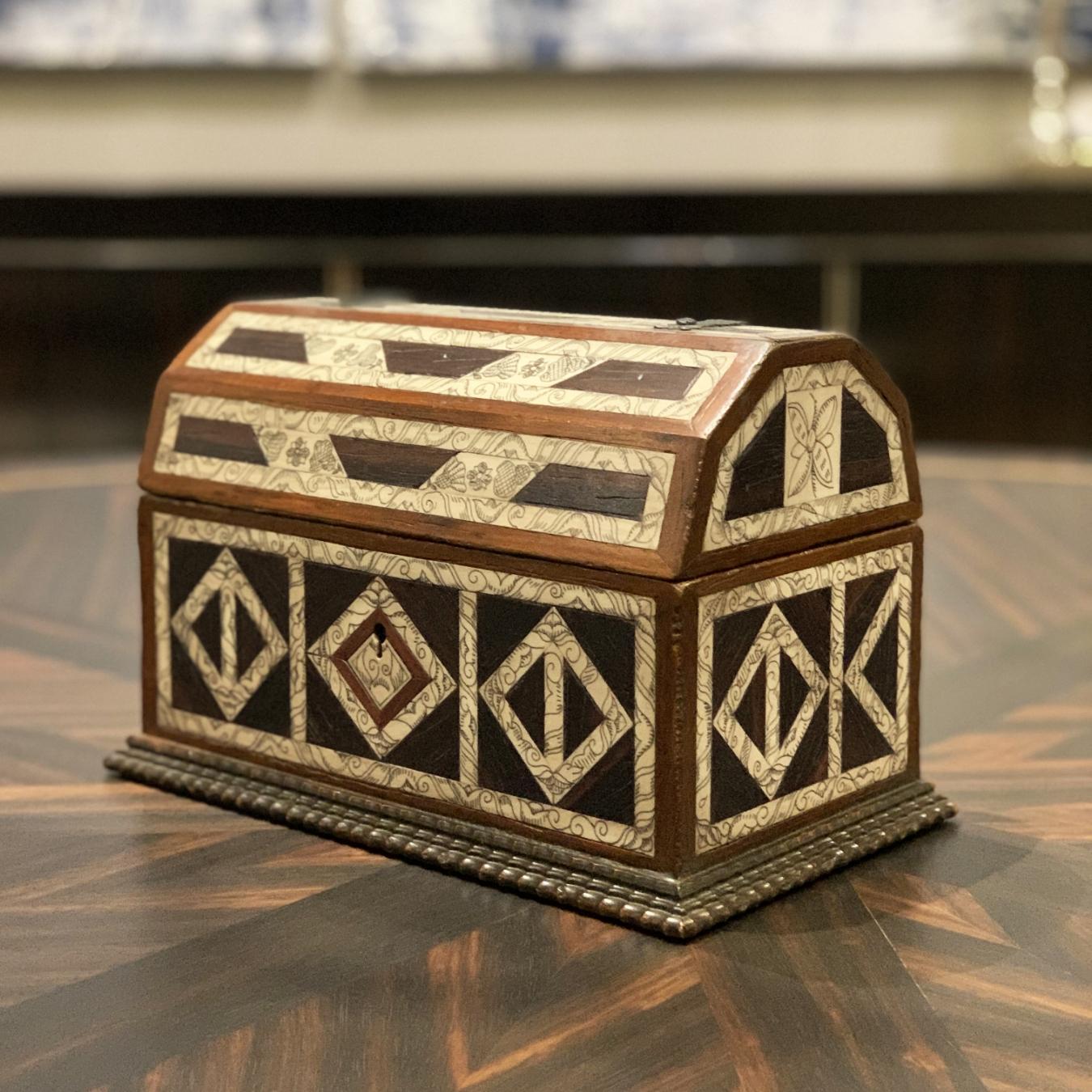 This mudejar styled small coffer is inspired by the XVIIth Century and is decorated with sgraffito bone with iron details.
