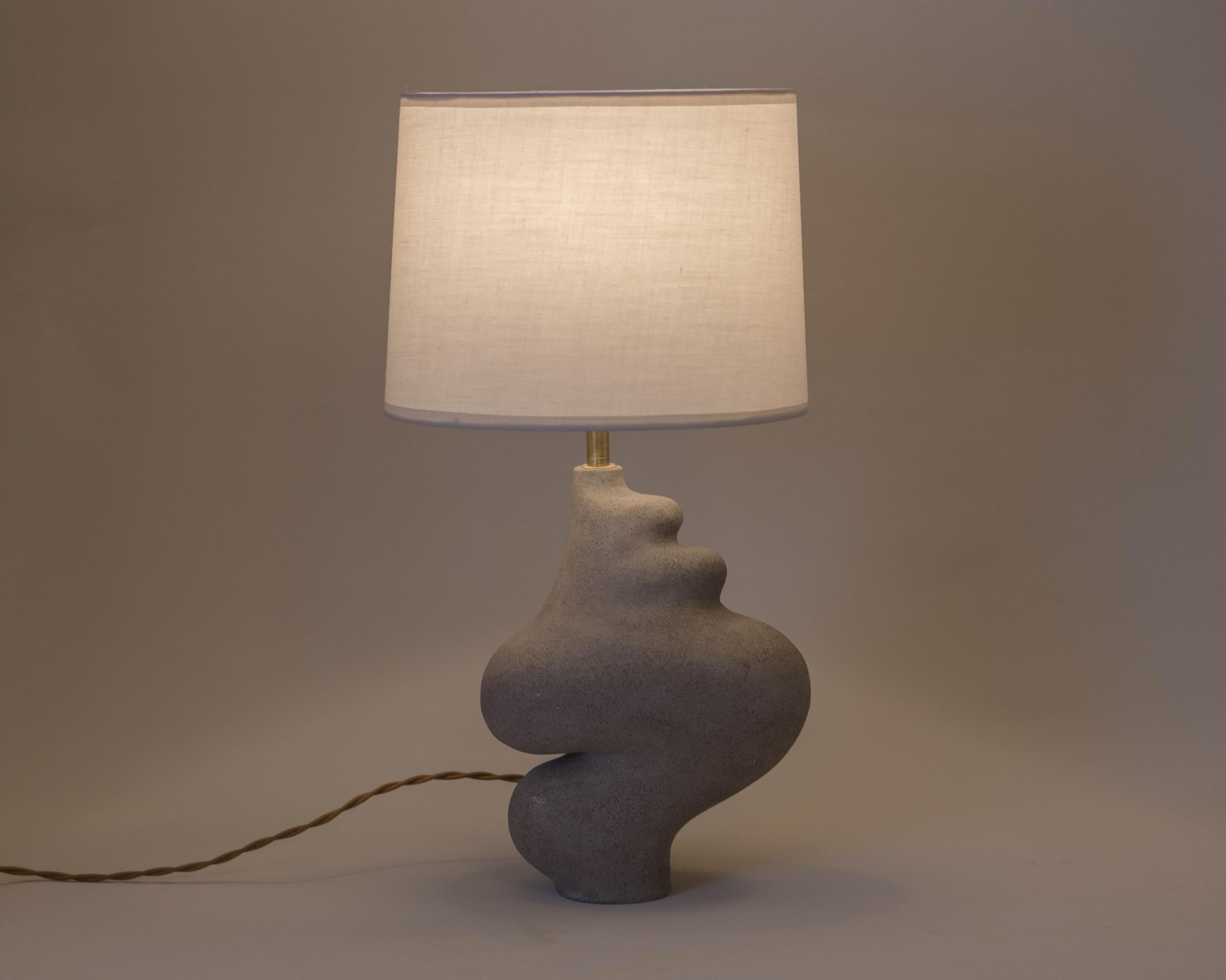 Muf lamp by Aysun Ay
Dimensions: D 20 x H 44
Materials: stoneware ceramic, brass hardware, cotton drum, CE certified twisted cable, non-slip bottom sole

Sculptural pieces can vary slightly as each is a unique piece of art.
All our lamps can be