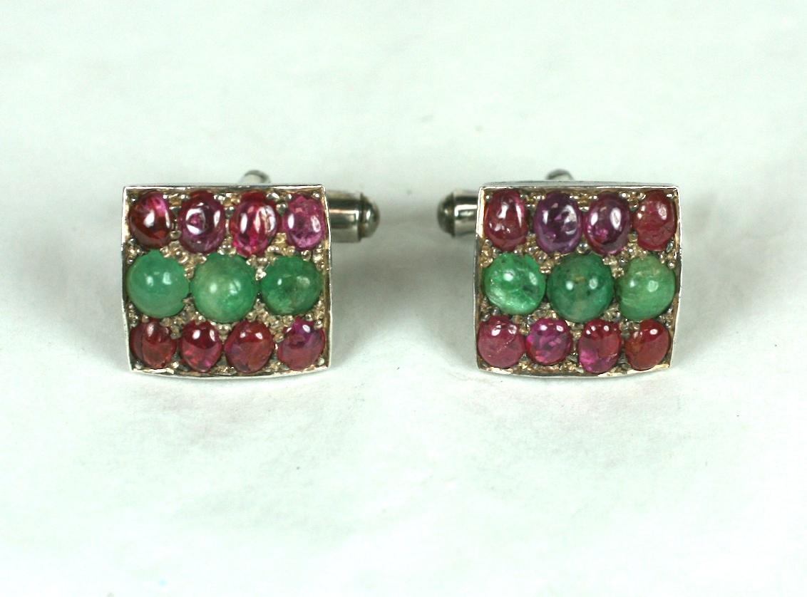 Elegant Mughal cufflinks of sterling silver, set with stripes of cabochon emeralds and rubies.
Toggle fittings. 
Excellent Condition.
L 5/8