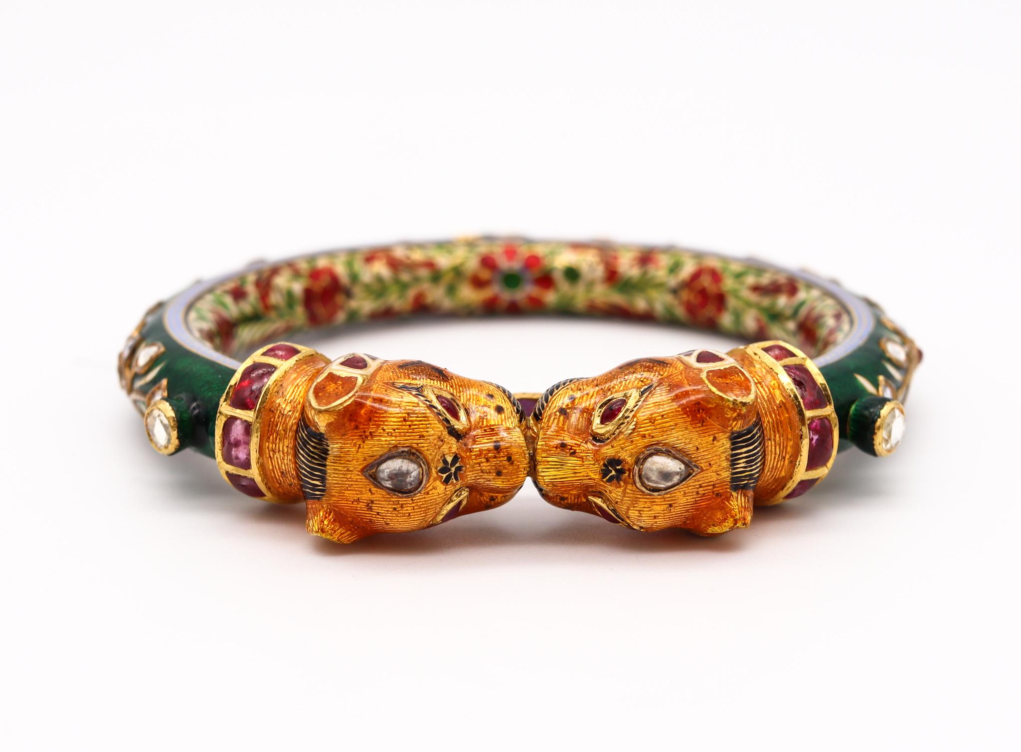 Gem set decorated lions bangle from the Mughal Empire.

Magnificent and colorful vintage bracelet, created in the ancient Mughal Empire style. This gorgeous bangle bracelet has been carefully crafted in solid yellow gold of 22 karats with high