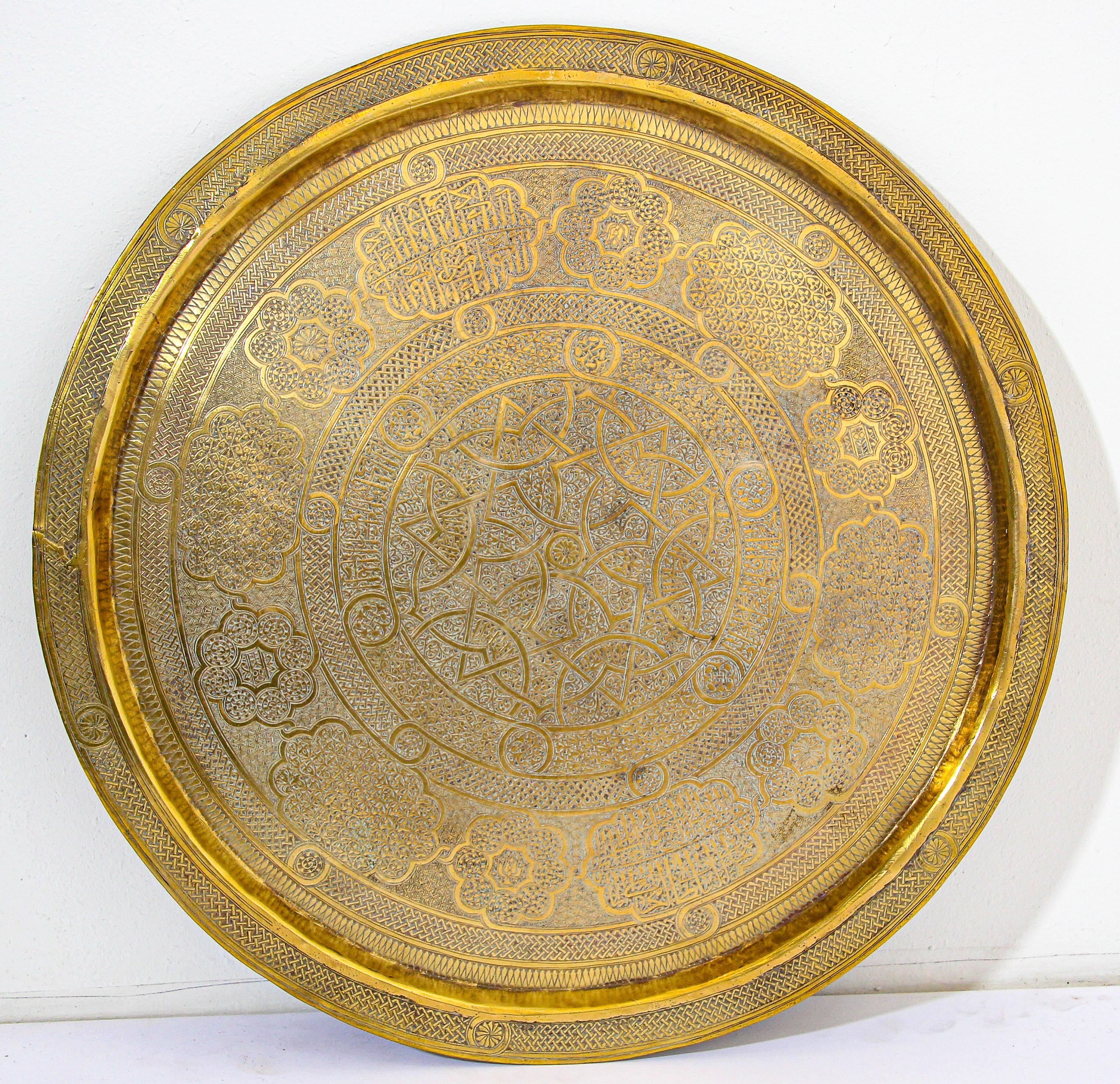 19th century Mughal Indo Persian fine antique brass round tray hand chased with Islamic calligraphy in Mameluke style.
19th century collector museum quality piece Mughal India style.
Heavy solid gold polished brass, embossed and hand graved with