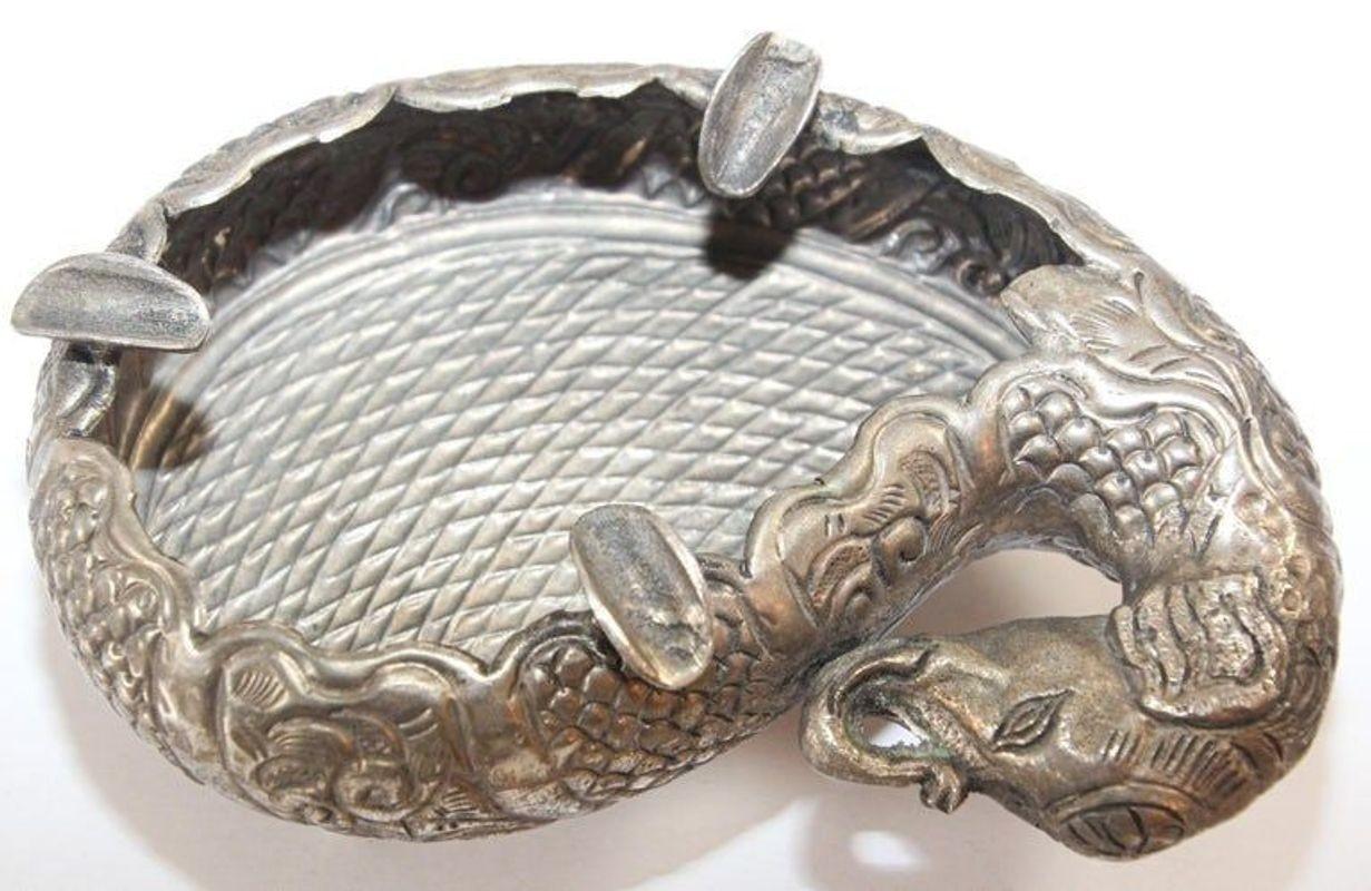 Vintage Mughal Indian Raj style elephant shape silver plated footed ashtray.
Asian silver plated metal hand chased and repousse fine decoration on an elephant shape figure ashtray.
Of a typical form the body is beautifully designed and decorated