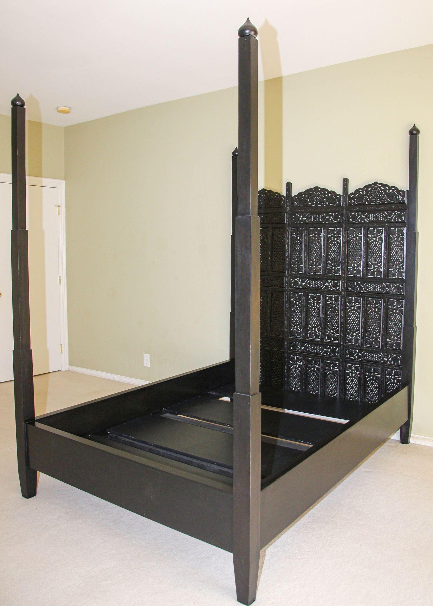 Indo Portuguese Mughal Raj queen Bed, Anglo Indian hand-carved Bed.
Baroque Lisbon style queen four poster bed in ebony dark black finish.
Often known as a Raj bed, the bed is hand made by craftsmen and carvers in India.
The head of the bed has
