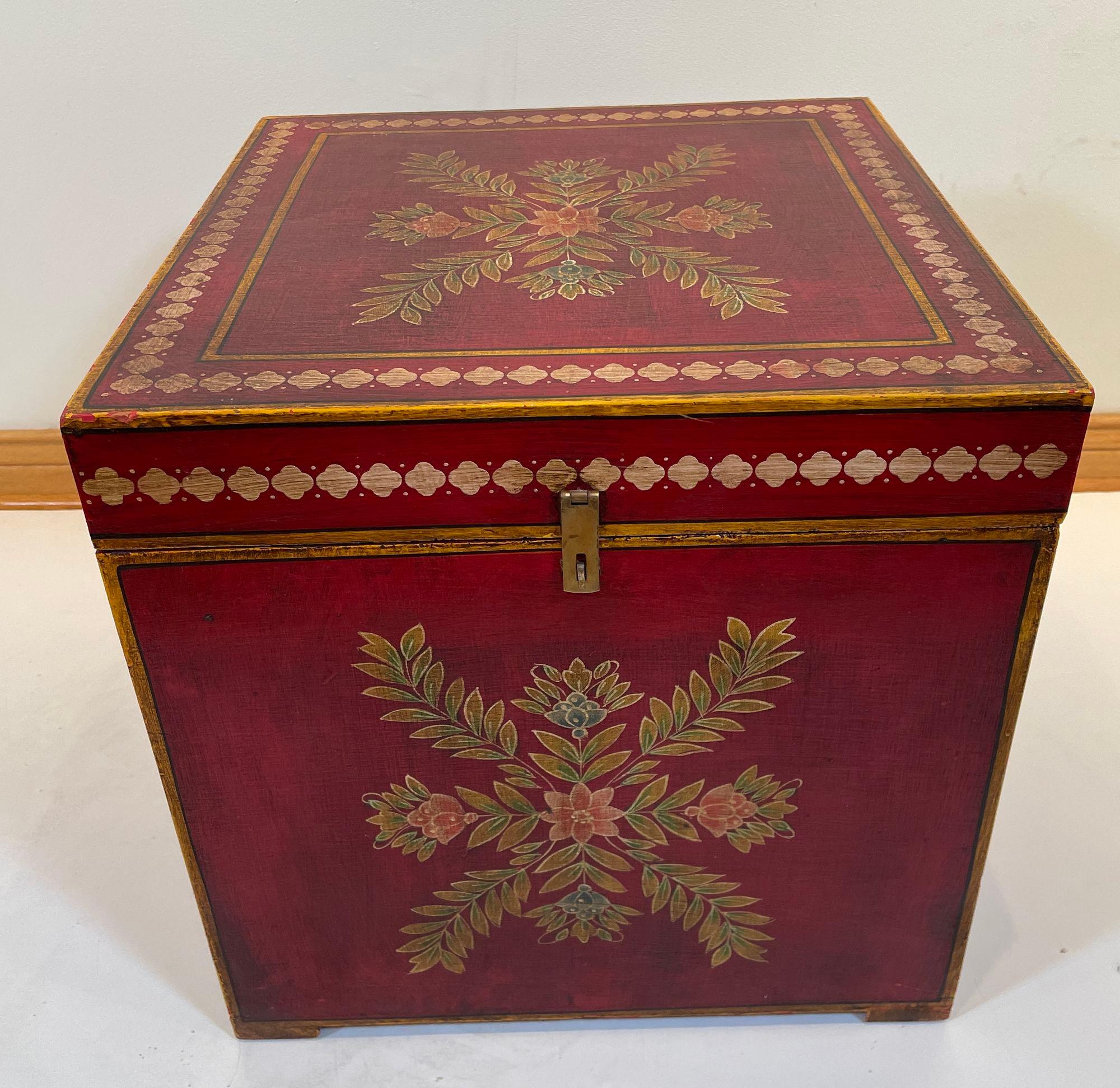 Vintage Folk Art lacquer hand painted decorative storage wooden trunk.
Mughal style small wood trunks with hinged lid clean lines and beautiful floral Rajasthani floral decor, this red lacquered side table will be an elegant decorative addition to