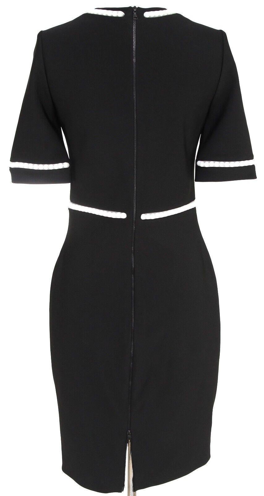GUARANTEED AUTHENTIC MUGLER EMBELLISHED FITTED DRESS

Retail $1,589
 Design:
 • Simple silhouette short sleeve black stretch jersey dress.
 • Tasteful and quiet mesh covered faux white pearls neckline, sleeve and waistline.
 • Round neckline.
 • Two