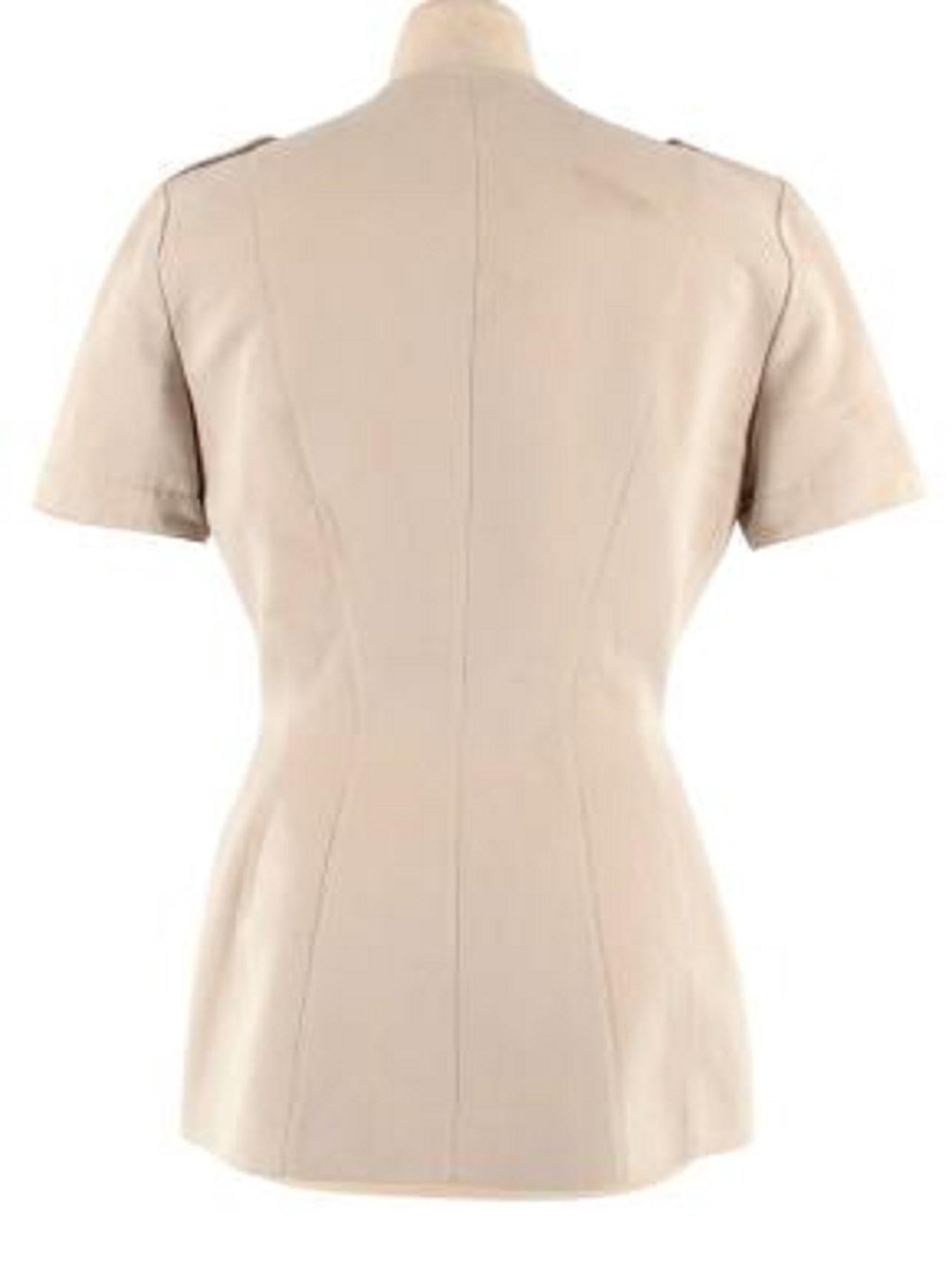 Mugler Cream Suede Safari Style Jacket

-Silver tone hardware 
-Multi pockets, Two flap press stud at the chest & two zip pockets at the chest 
-Zip fastening along the front 
-Slim fit 
-Fully lined 
-V-neckline 
-Belt closure at the waist