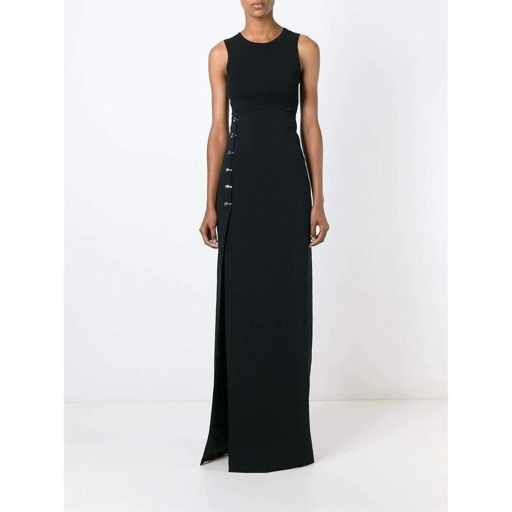 A long, striking column skirt by Mugler, accented with polished hardware along the sexy crossover slit. 
Hidden back zip. 
Lined.
Fabric: Textured crepe suiting.
52% acetate/45% viscose/3% elastane.
Dry clean.
Made in Italy.
 
Measurements
Length: