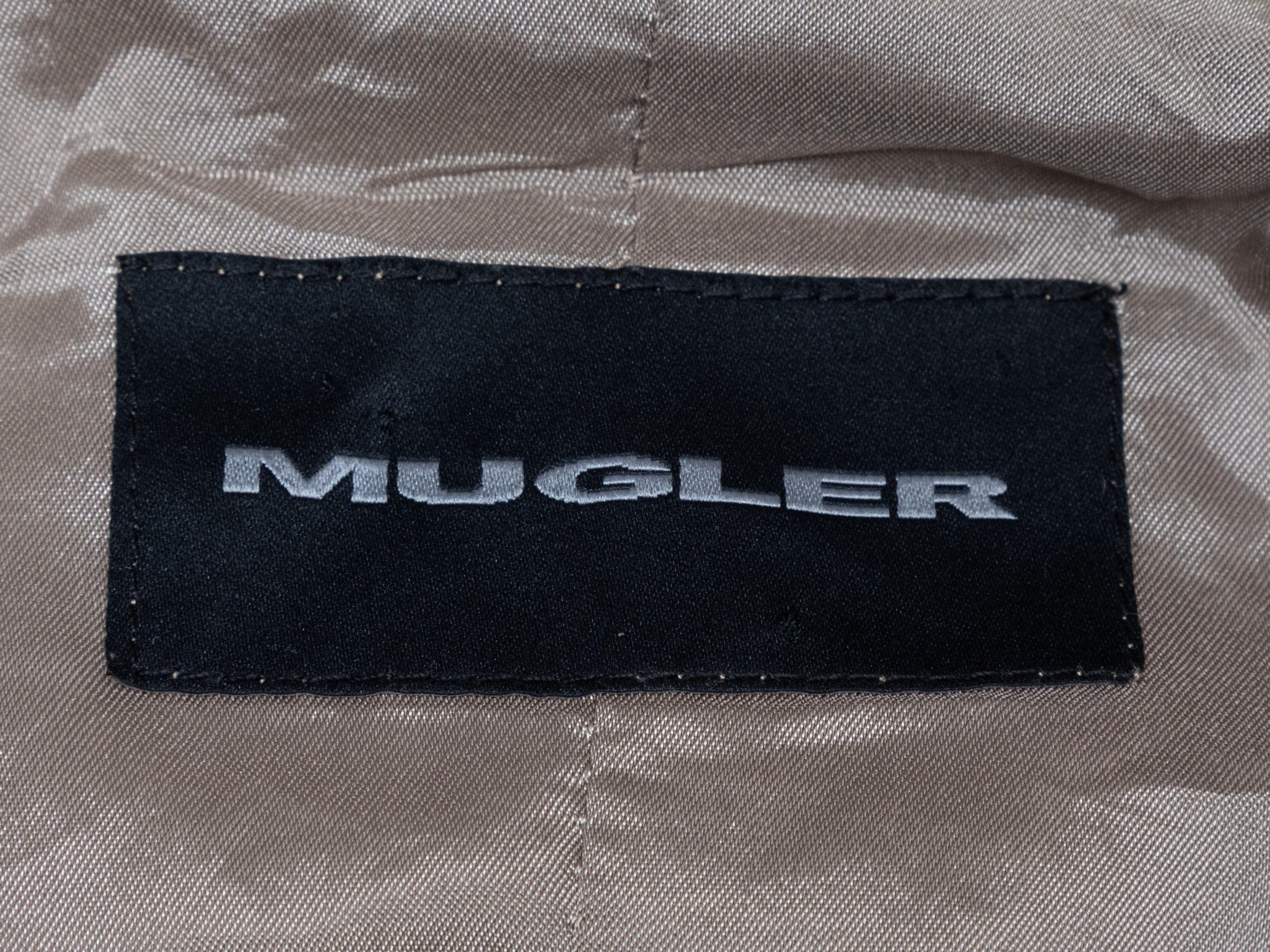 Product Details: Vintage silver nylon jacket by Mugler. Stand collar. Snap accents. Zip closure at center front. 40