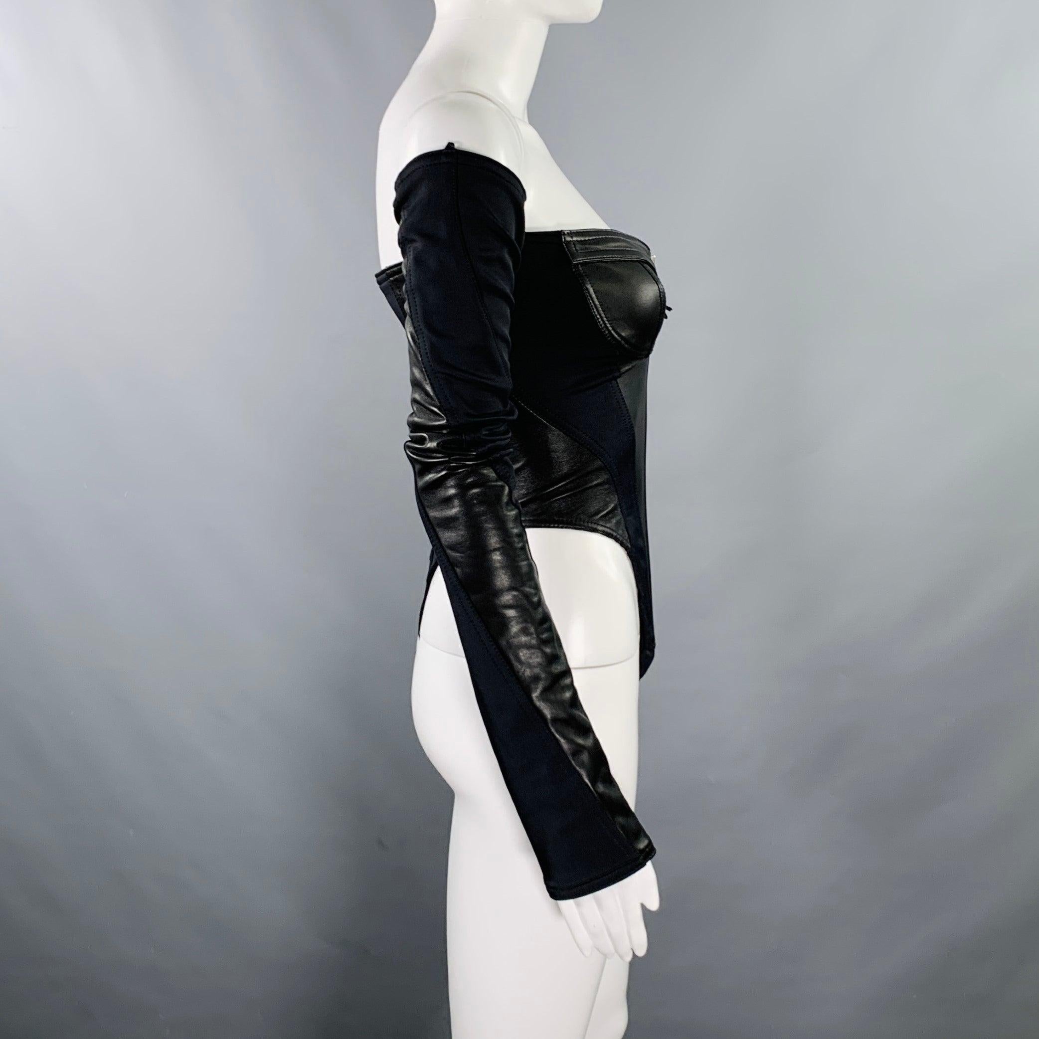 MUGLER bodysuit in a black lambskin leather and stretchy nylon blend featuring an off-shoulder style, paneled construction, silver tone metal zipper front, and a three snap crotch closure. Made in Poland.Excellent Pre-Owned Condition. 

Marked:   34