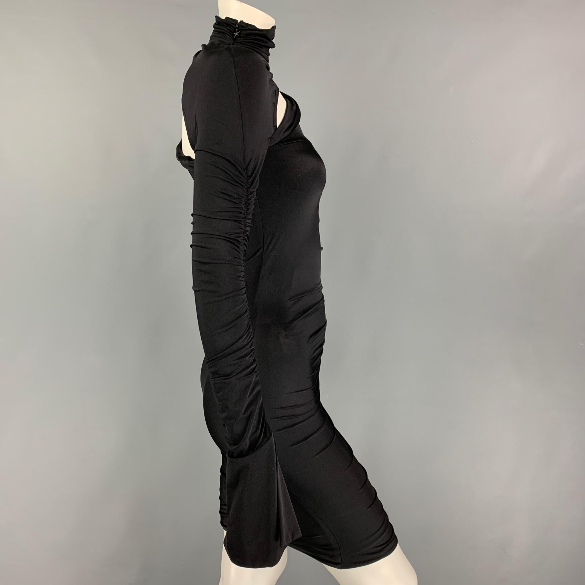 MUGLER dress comes in a black stretch polyamide / elastane material featuring an asymmetrical style, ruched design, long sleeves, cut-out detail, high collar, and a side zipper closure.

Excellent Pre-Owned Condition.
Marked: 34
Original Retail