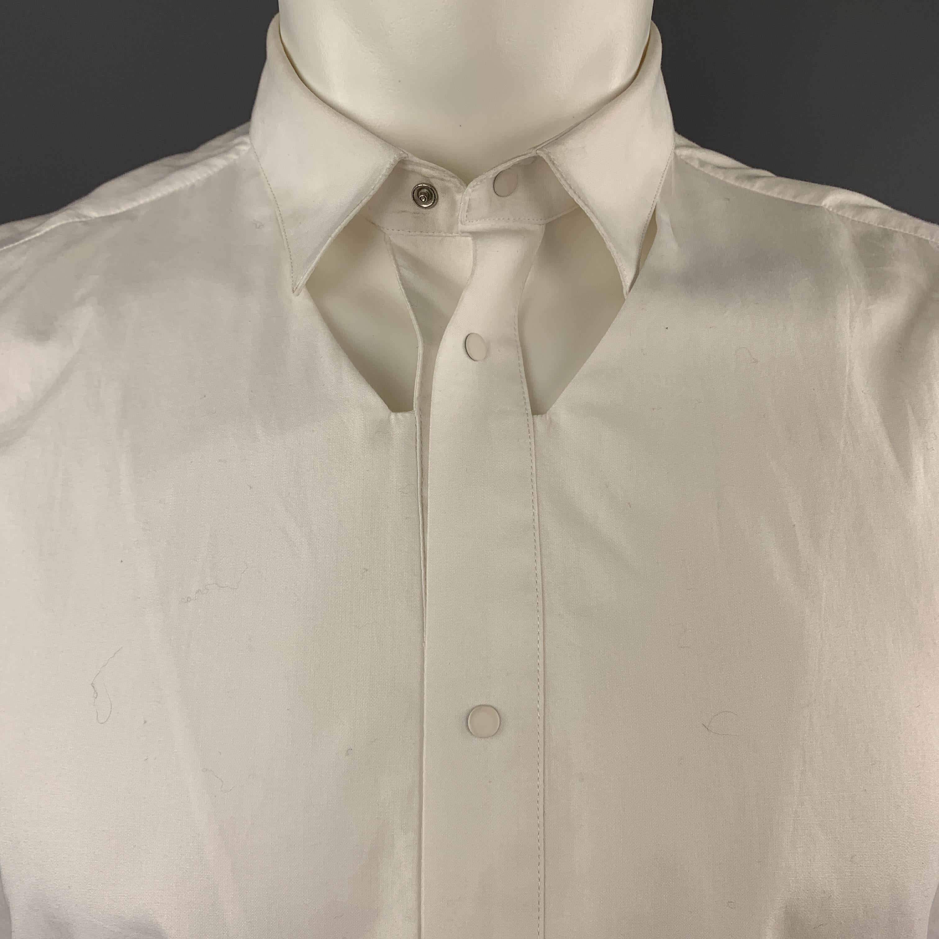 MUGLER by NICOLA FORMICHETTI shirt comes in white cotton with a pointed collar, white snap closure front, and chest cutouts. Wear throughout. As-is. 

Good Pre-Owned Condition.
Marked: 40

Measurements:

Shoulder: 17 in.
Chest: 40 in.
Length: 28.5