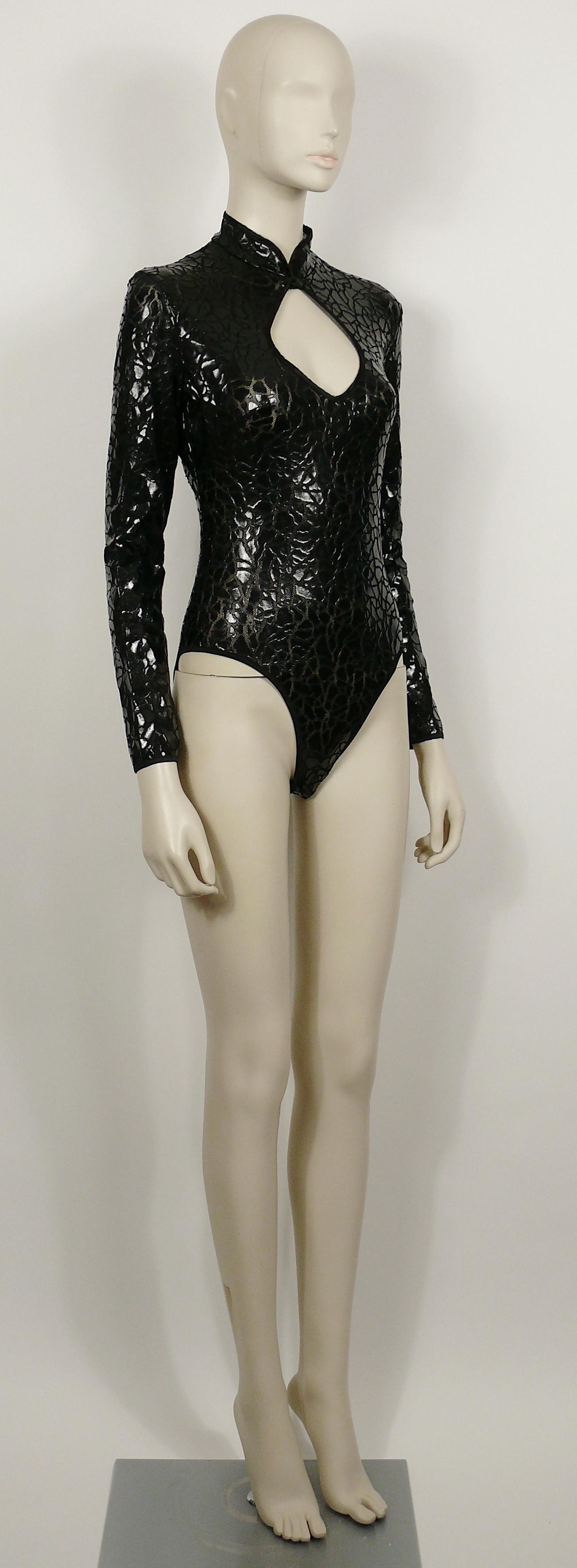 MUGLER vintage long-sleeve black mesh bodysuit featuring a crack design all over.

Back zippered closure.
Buttoned collar.

Label reads MUGLER.
Made in Italy.

Size tag reads : M.
Please check measurements.

Composition tag reads : 100% Nylon.
