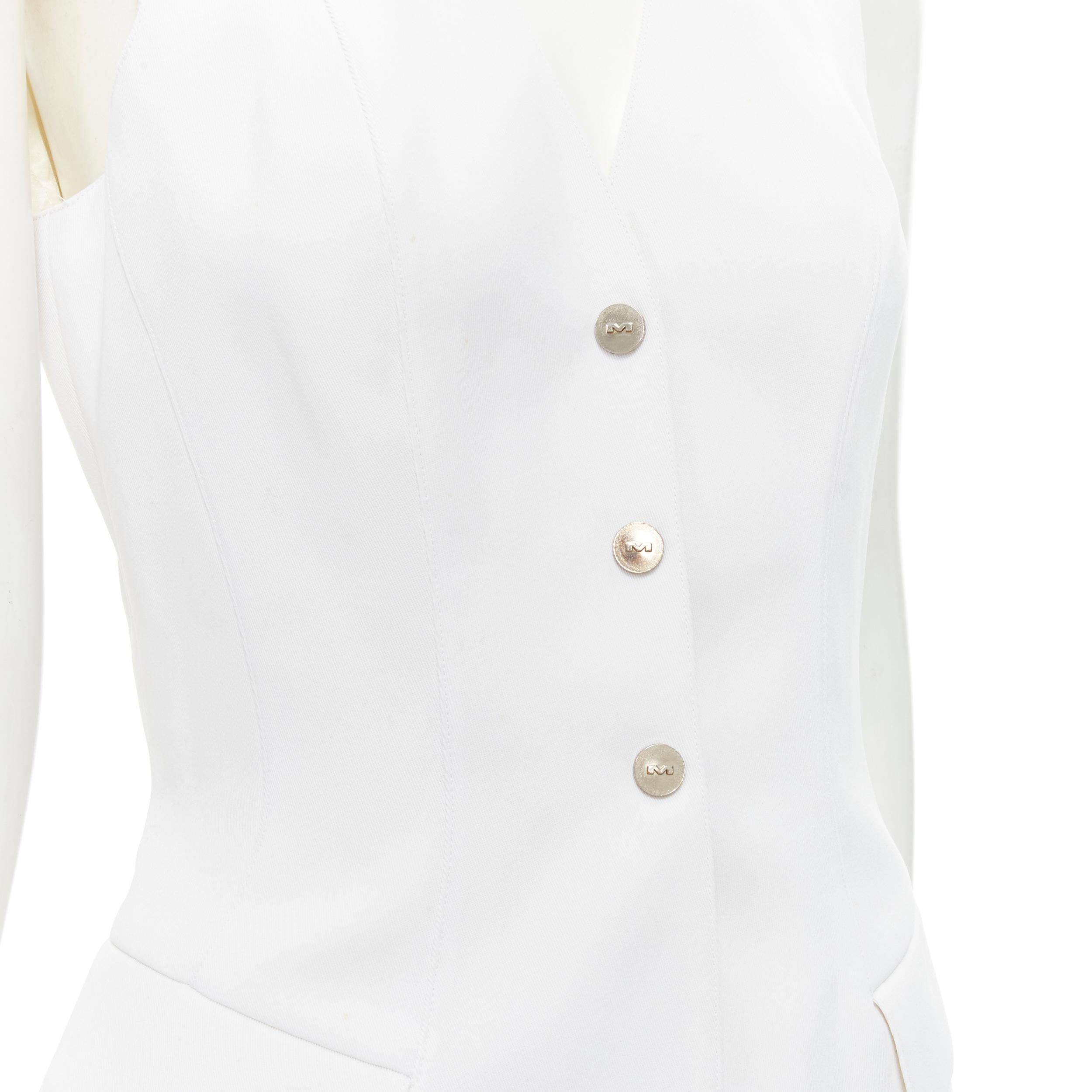 MUGLER VIntage white polyester body sculpted seams silver button vest M 
Reference: GIYG/A00248 
Brand: Mugler 
Material: Polyester 
Color: White 
Pattern: Solid 
Closure: Snap button 
Extra Detail: Brown M logo buttons. Bodycon sculpted seams.