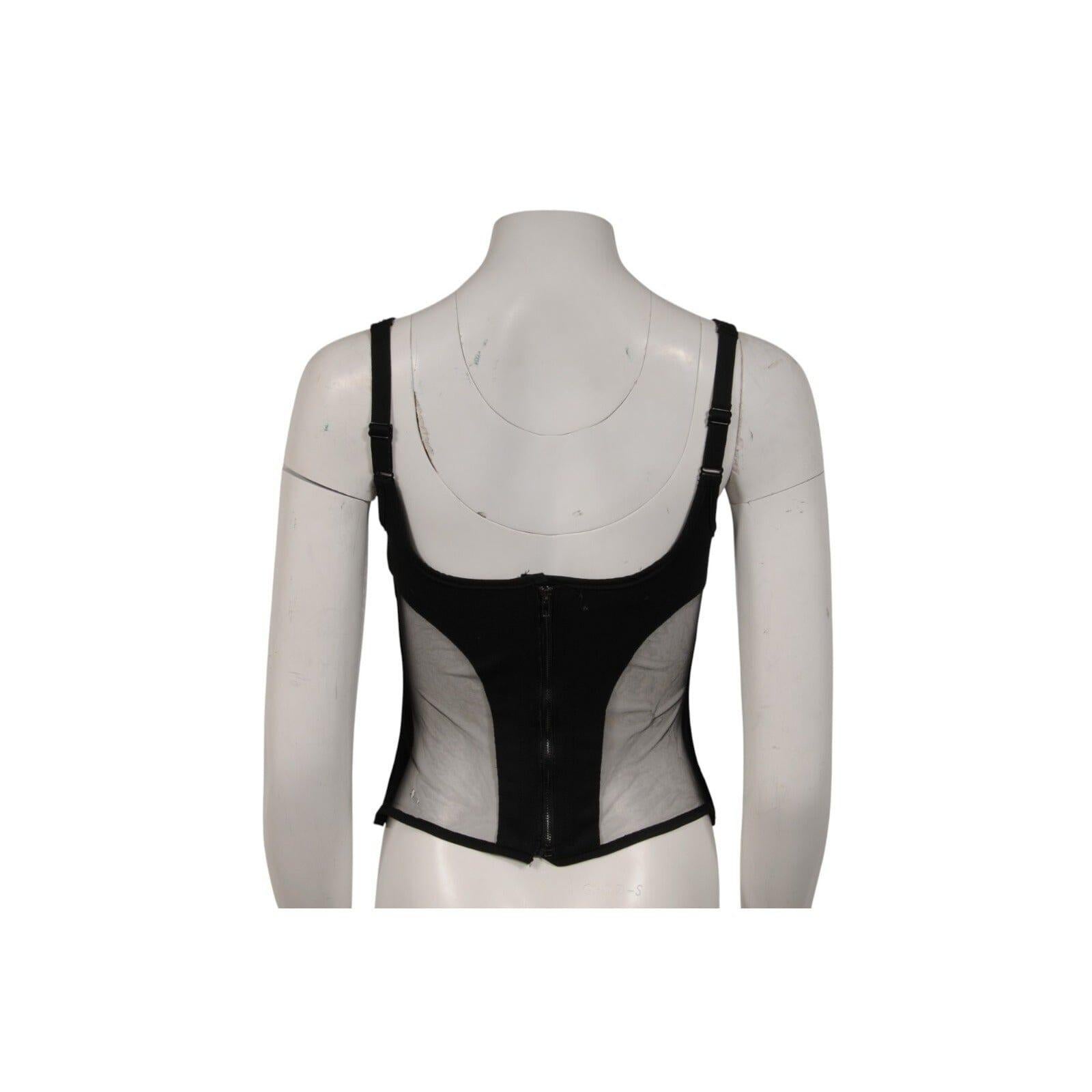 - Exterior negro

- Sin etiqueta de talla se estima que es una mediana

- Sin etiqueta de tejido se siente como una mezcla de poliamida



Estado: 

La parte superior está en muy buenas condiciones, sólo tiene un poco de blanqueamiento de la tela a