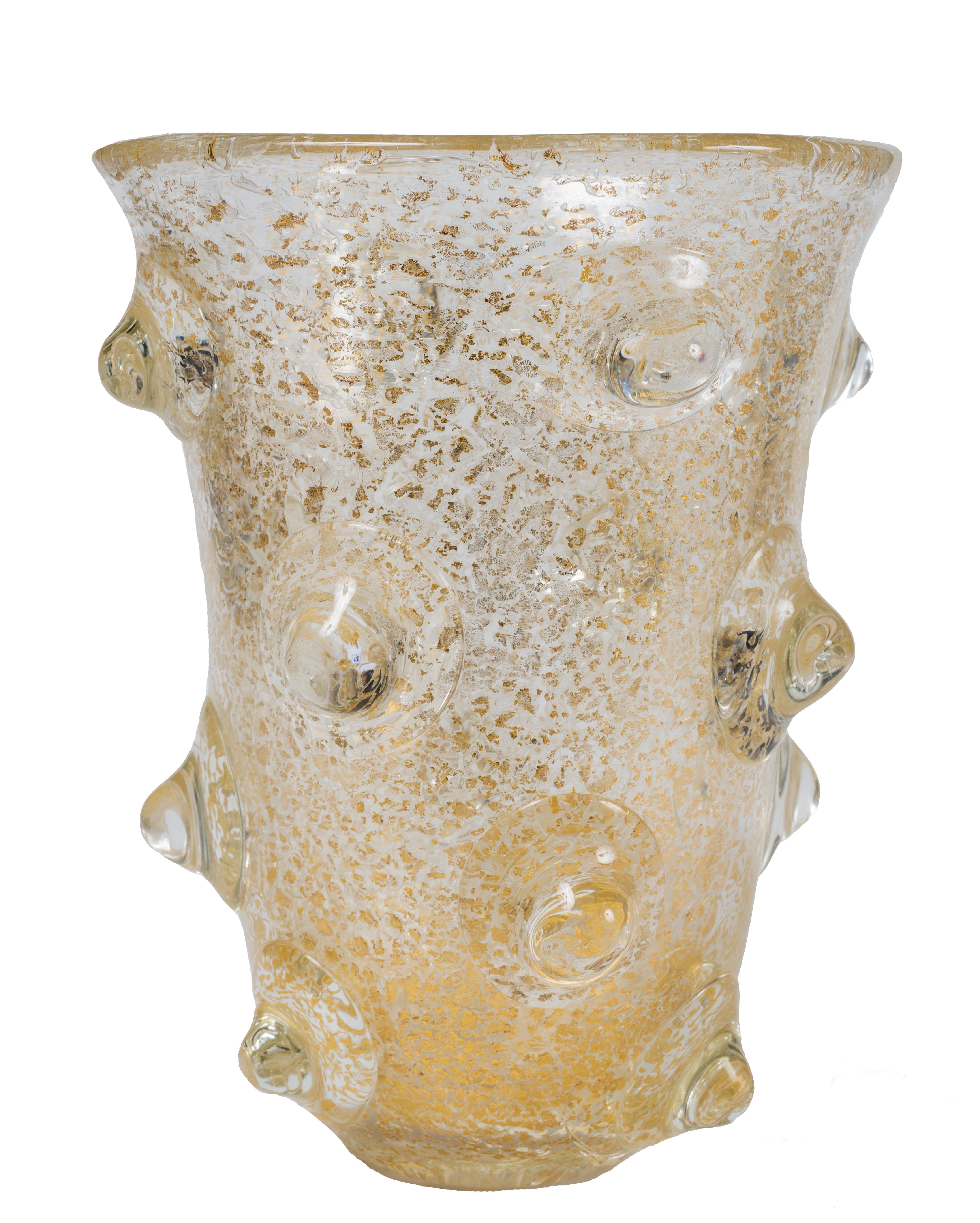Mugnoni Vase is an elegant Murano-glass vase realized by Ercole Barovier for Barovier & Toso in 1938 ca.

The vase is decorated with large hemispherical reliefs with air bubbles.

Fair conditions. Minor diagonal scratch of 9 cm. ca. starting