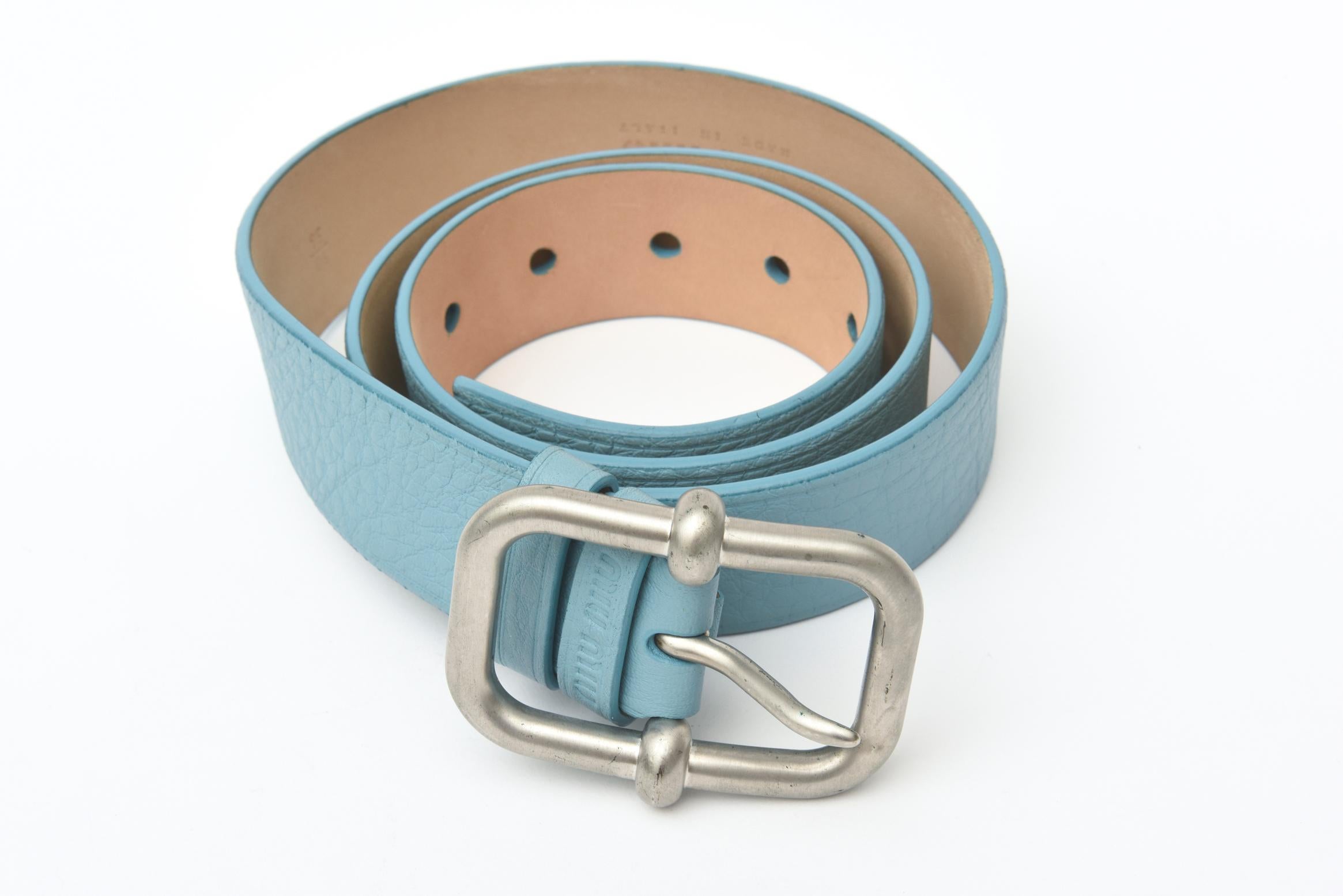 This wonderful pebbled leather belt has never been worn it was made in Italy for MUi Mui which is a subsidiary of Prada and is headed by Miuccia Prada and headquartered in Paris France. It is the lovely cornflower blue meets tiffany blue meets light