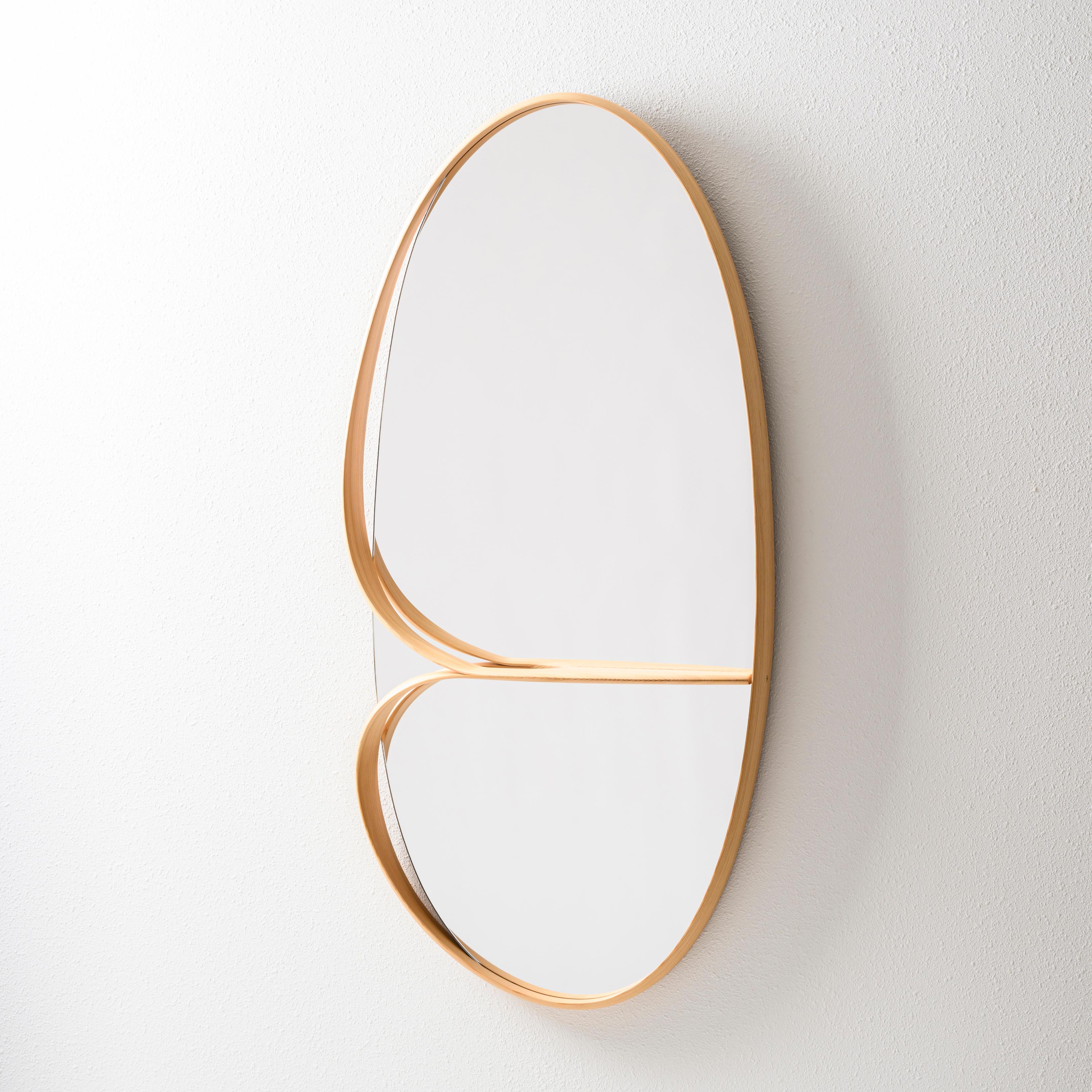 Muji wall mirror. 
Kenta Hirai created it with the technique 