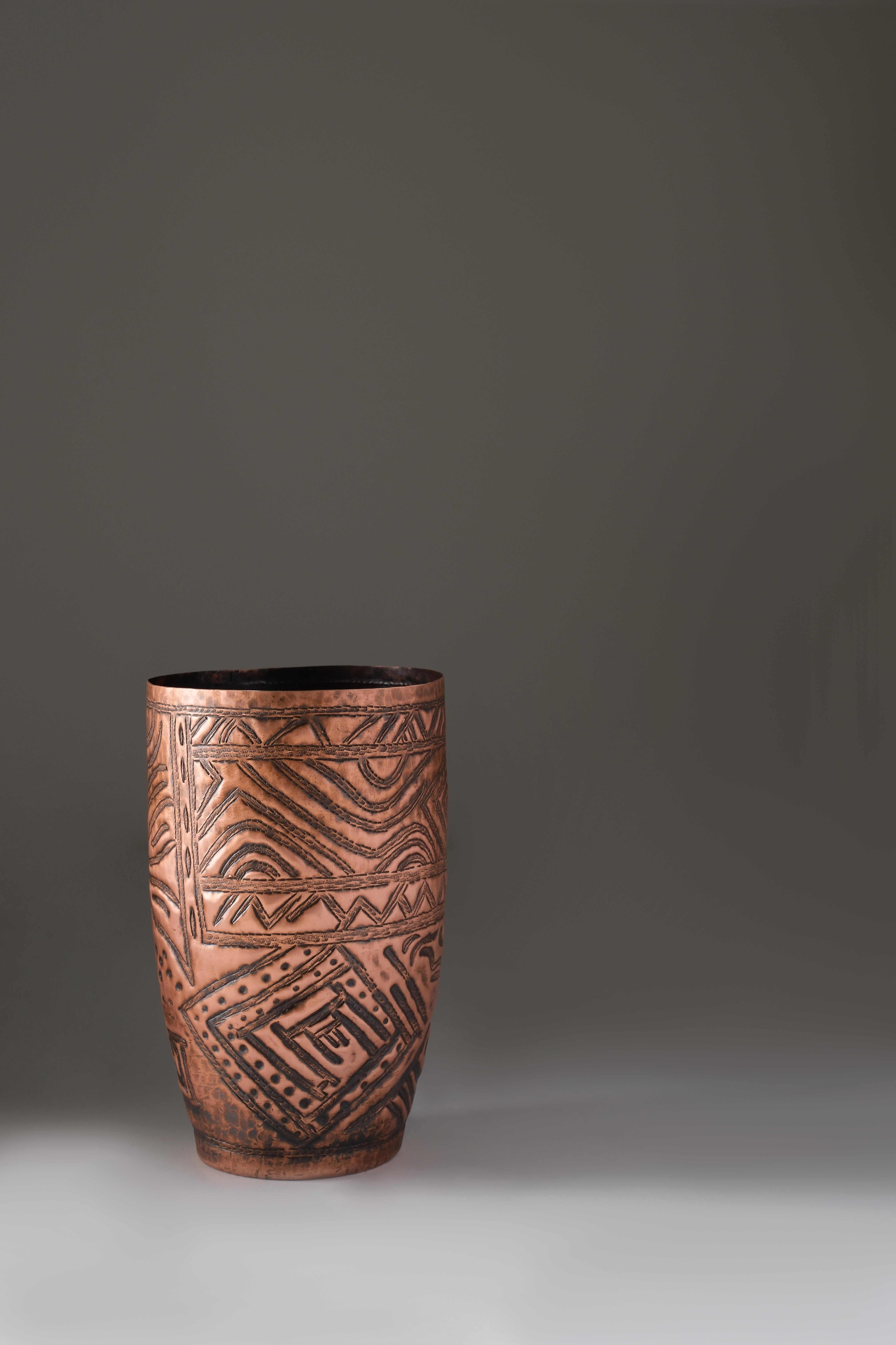 Mul Vase by Ayse Zelal Tugrul
One of a Kind
Dimensions: D 18 x H 30 cm.
Materials: Copper.

Vase “Mul” takes its name from the Sumerian word “star”, it represents the connection between the earth and the cosmos.

Zelal, born in Diyarbakir, in the