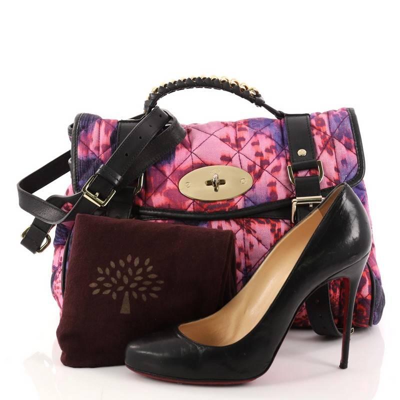 This authentic Mulberry Alexa Satchel Quilted Printed Denim Medium depicts a playful and functional style. Constructed in multicolor quilted denim in loopy leopard pink and purple print, this special edition satchel features black leather trims,