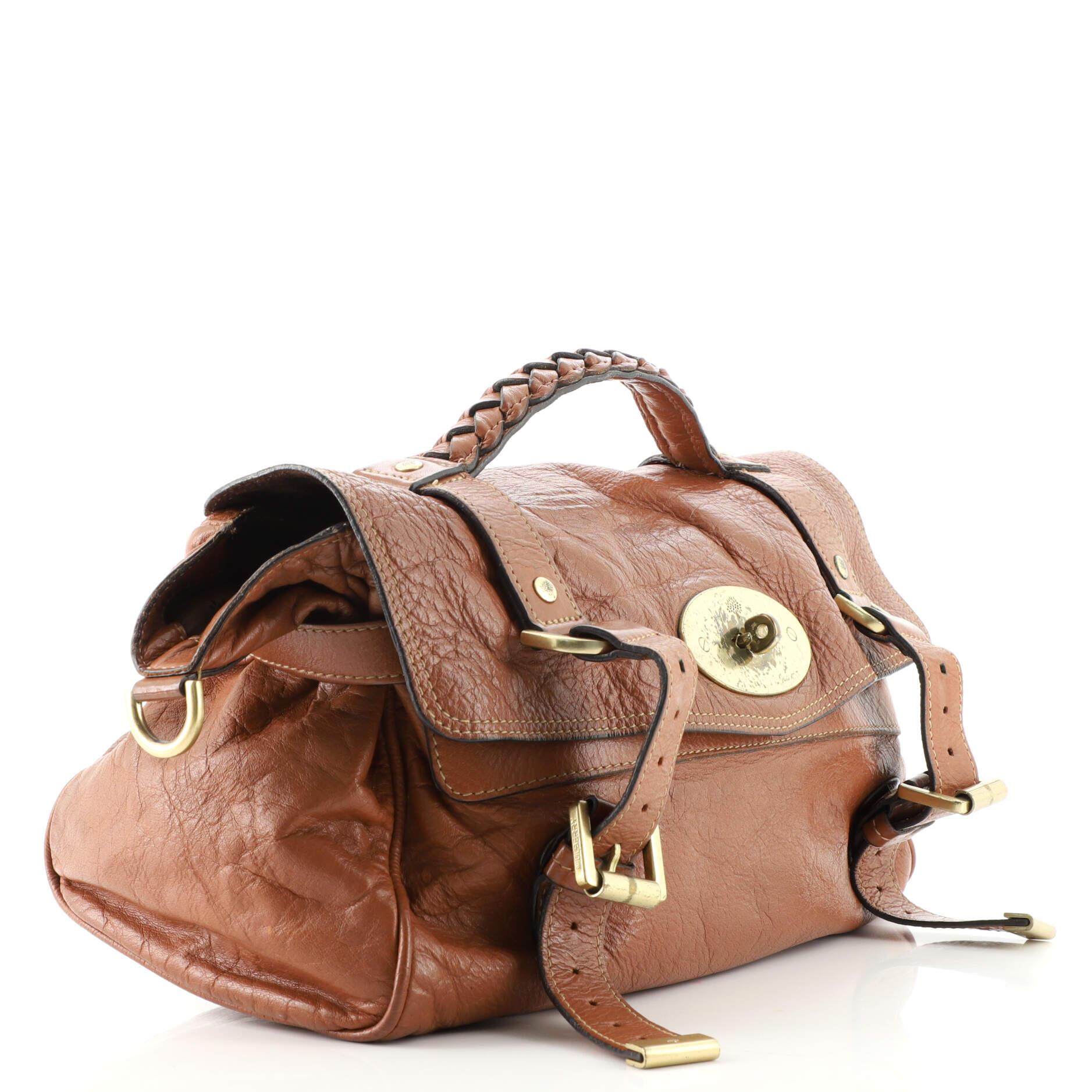 Condition: Outlet. Wear and moderate creasing on exterior, darkening on base corners, wear on strap, handle and in interior. Splitting on handle, strap, closure trim and side opening wax edges, heavy darkening, creasing, marks and wear underneath